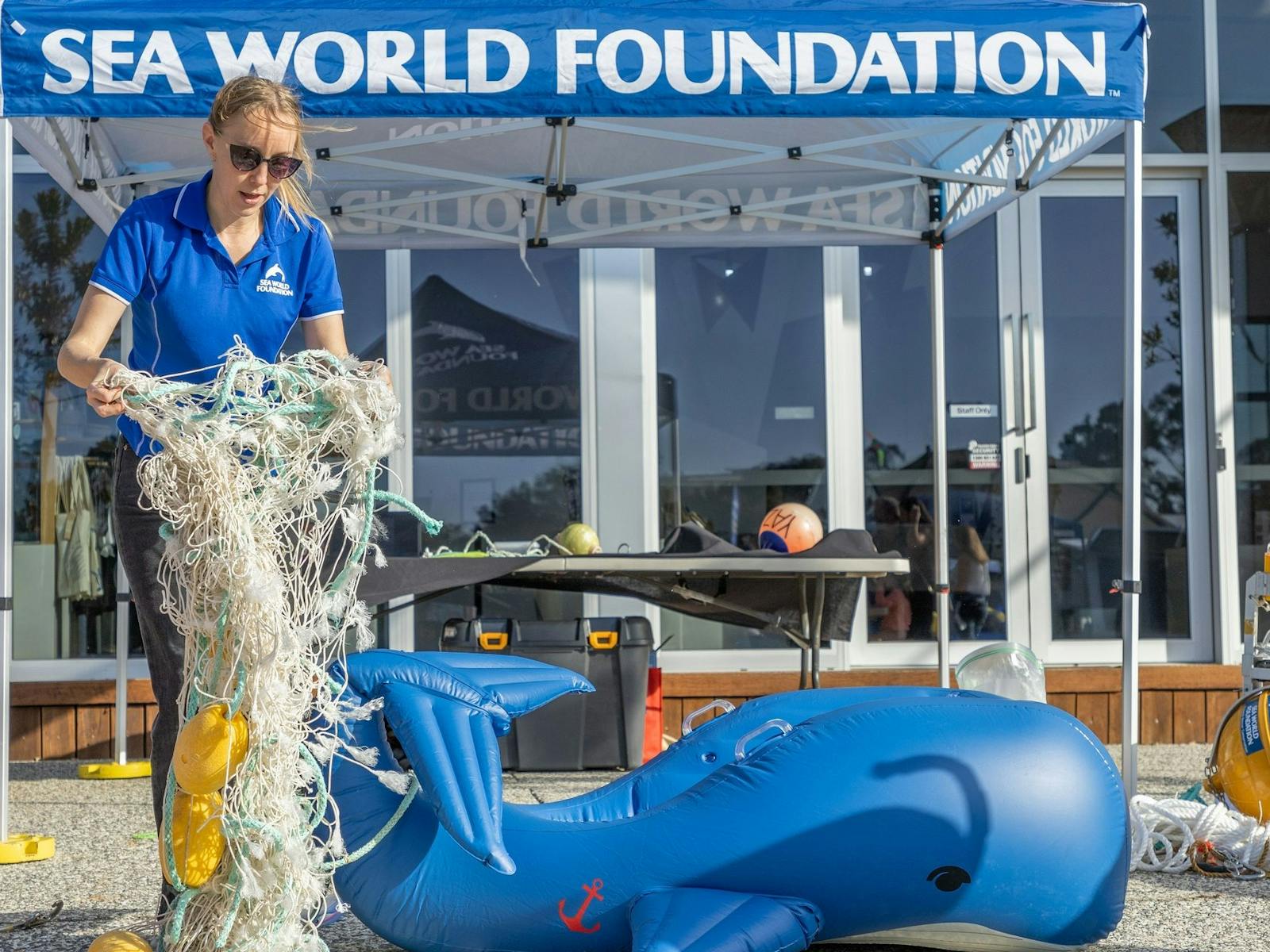 Sea World Foundation educating patrons how to safe whales trapped in nets.
