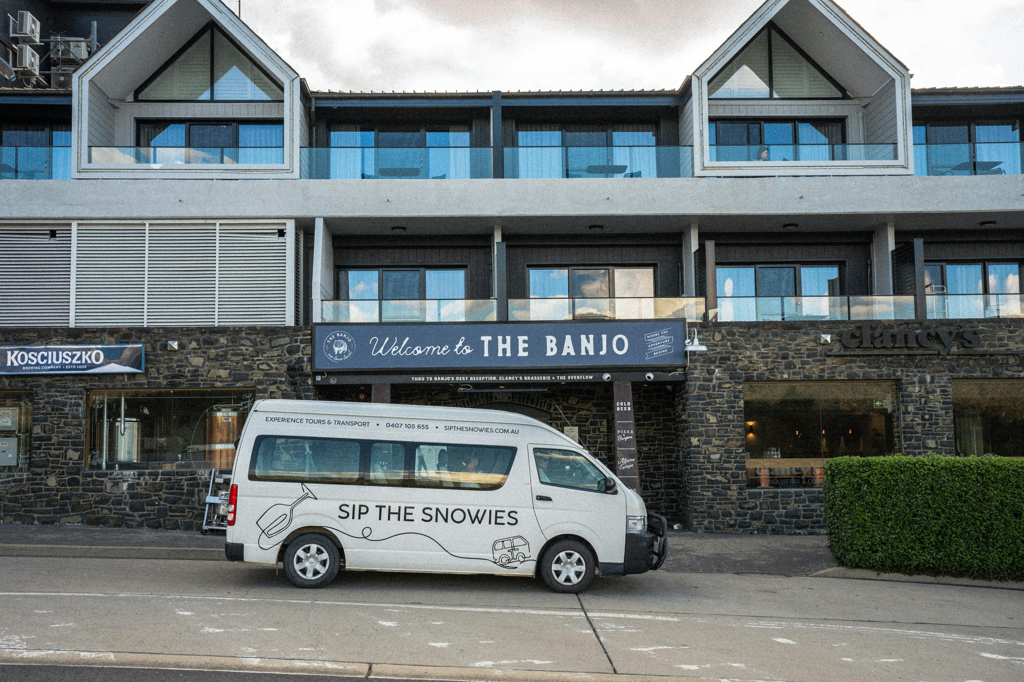 The Sip the Snowies tour bus parked in front of the Banjo Paterson Inn Hotel Jindabyne
