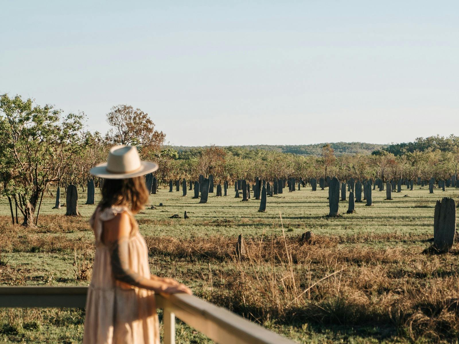 Lady standing in front of the Magentic Termite MOunds in Litchfield