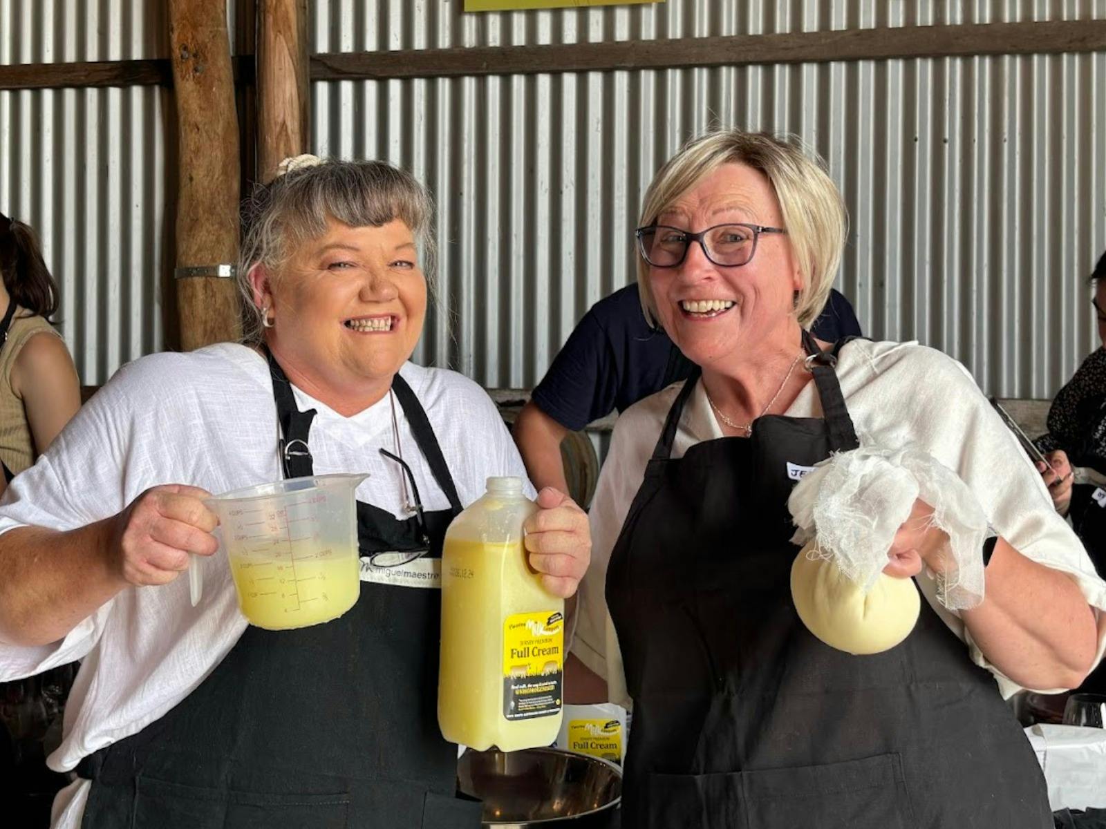 two ladies holding cheese