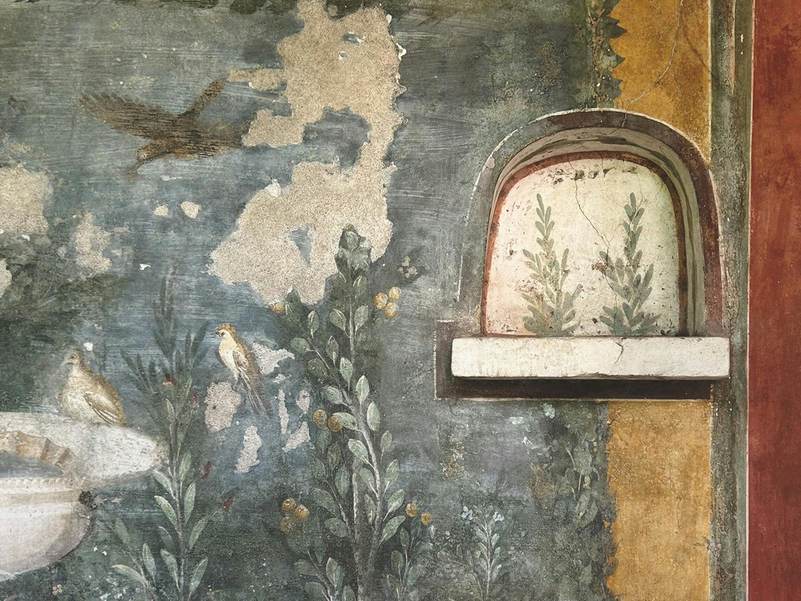 Photo of a ruined wall at the site of Pompeii