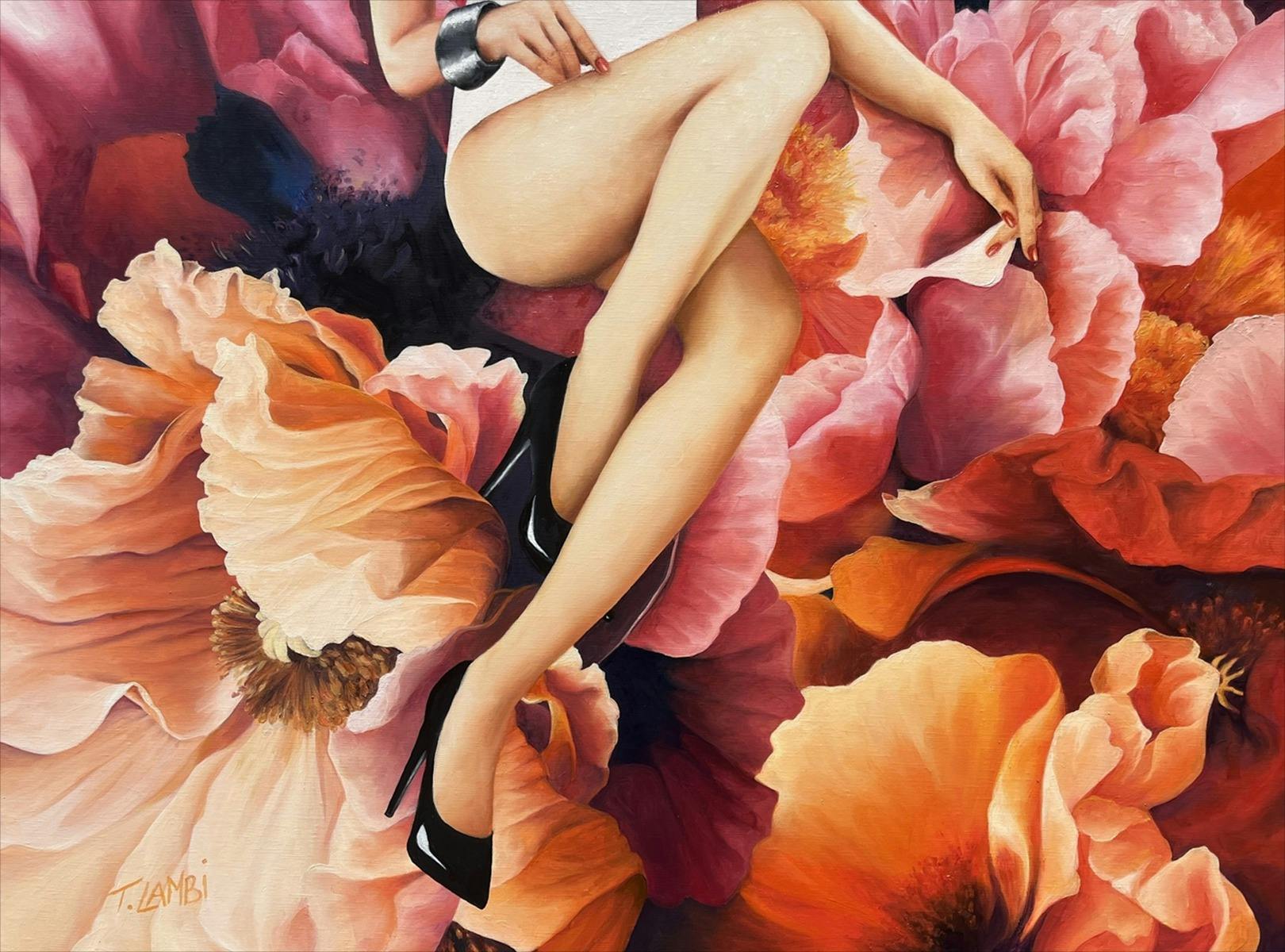 A woman sitting in beautiful flowers
