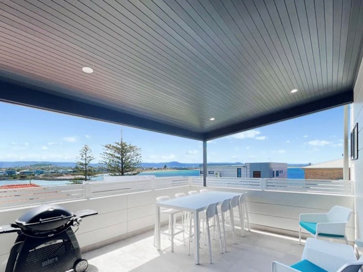 Outdoor entertaining on the veranda at Beach Side Luxury at the Point, Barrack Point, Shellharbour