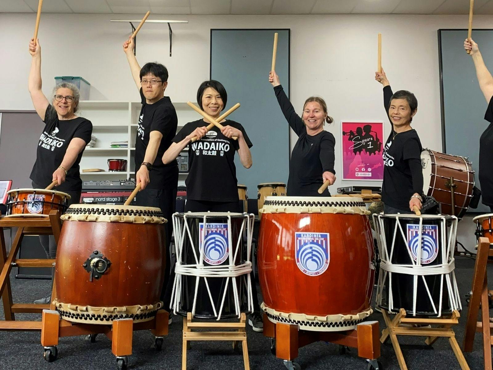 ^ people drumming