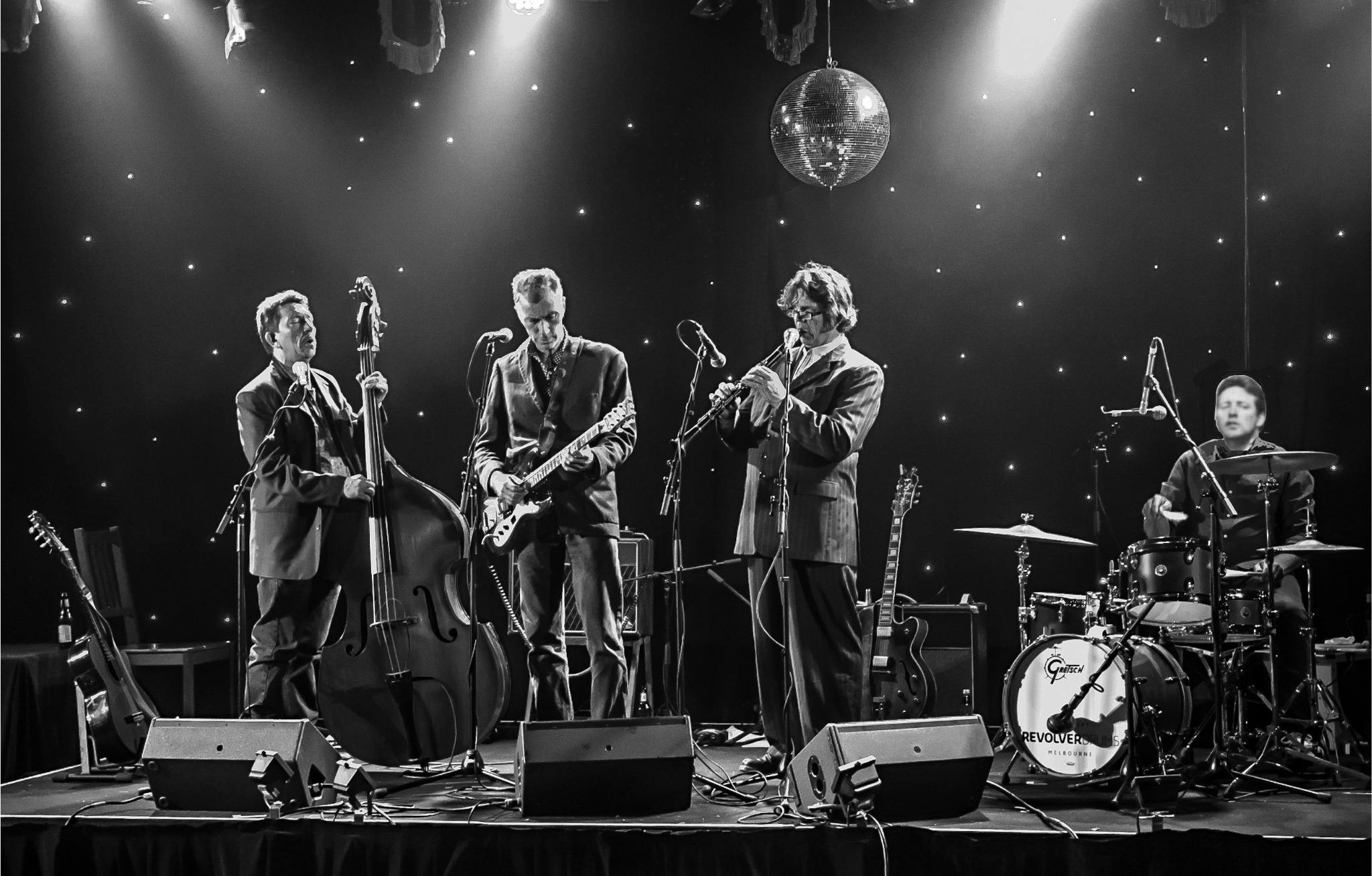 group of musicians performing on stage