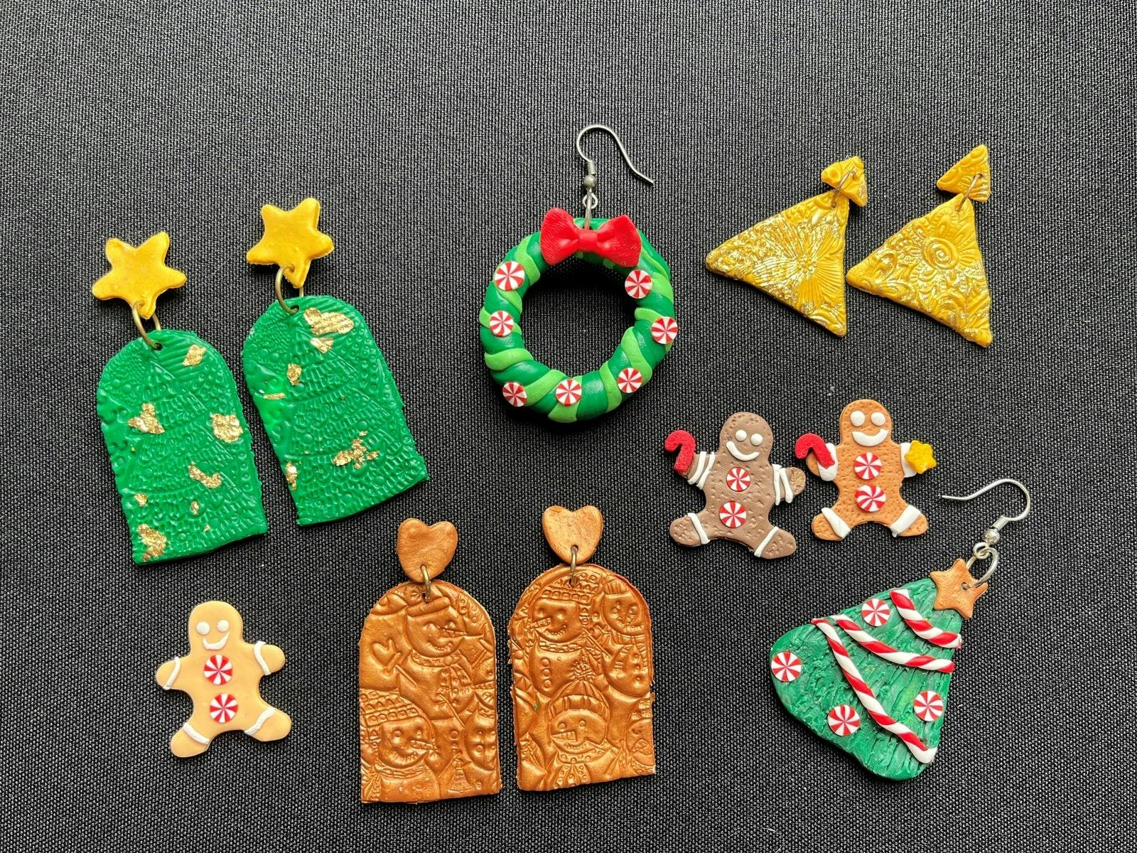 pairs of homemade festive earrings are laid out on a table