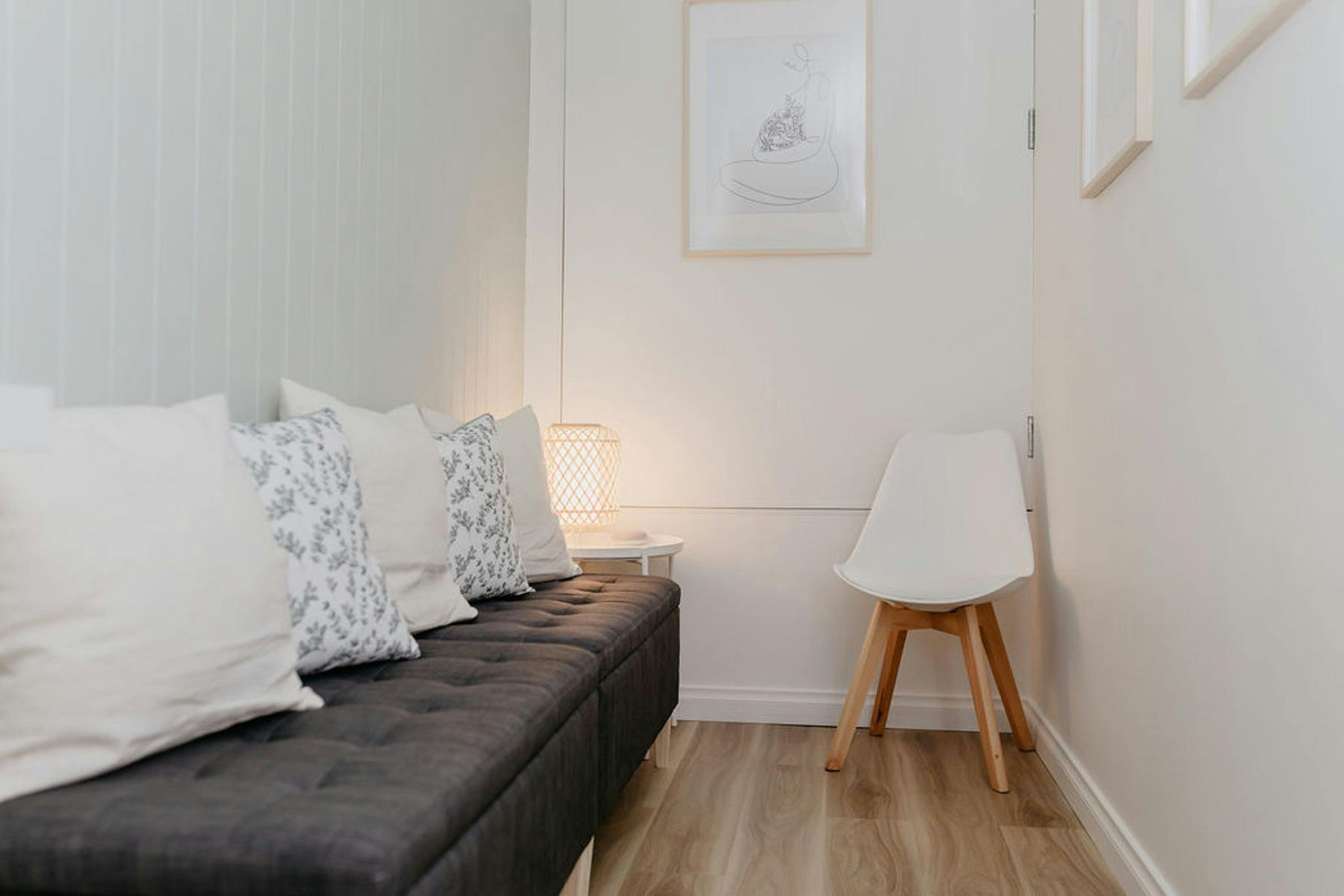 cushioned booth seating with cushions and artwork