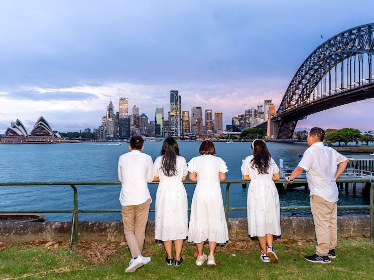 A group looks out across the Sydney Harbour