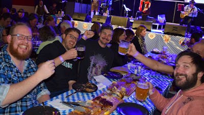 Photo of group of young men toasting a good time at Schnappsfest 2025