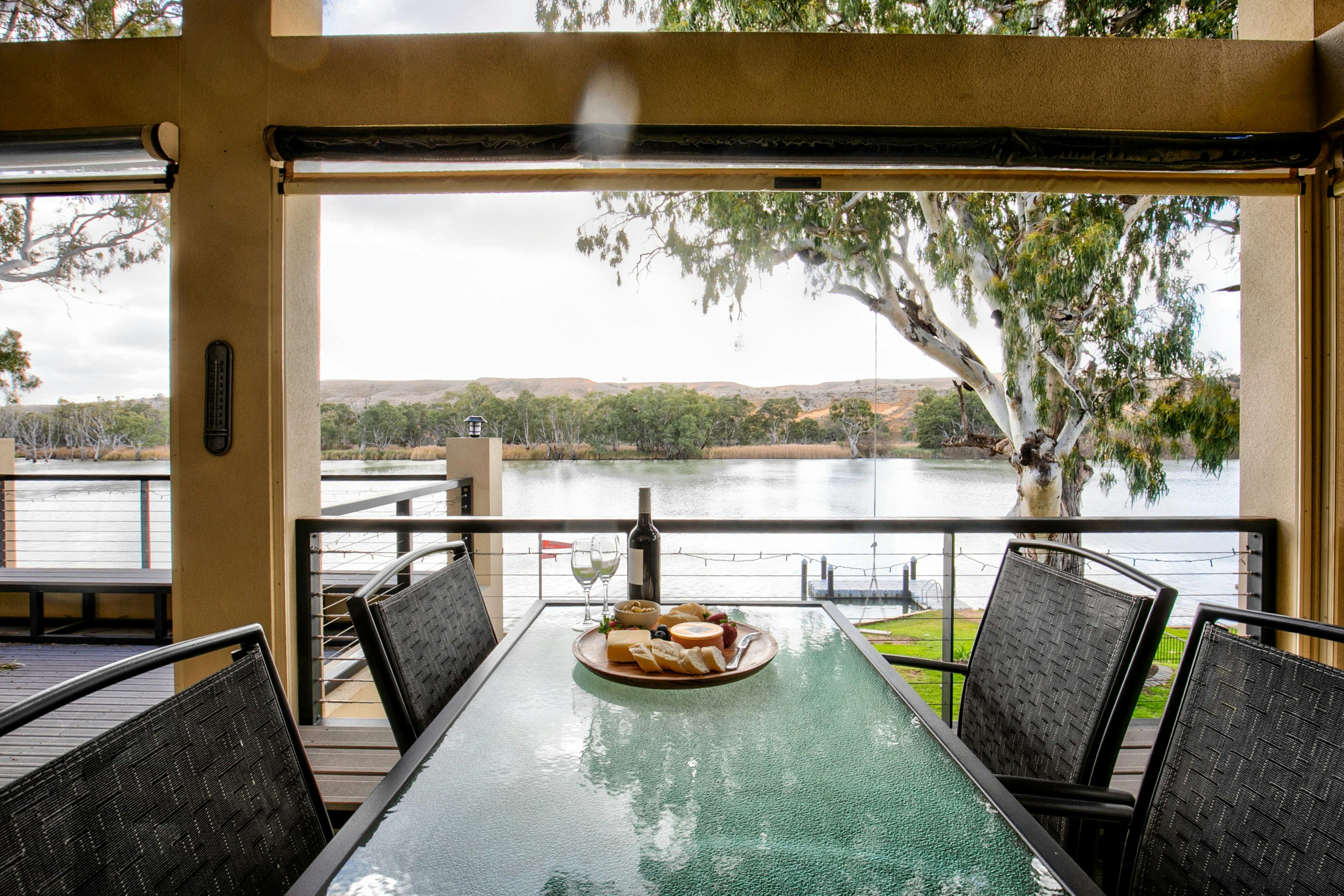 Large balcony area with BBQ, breakfast bar, outdoor dining and reading area