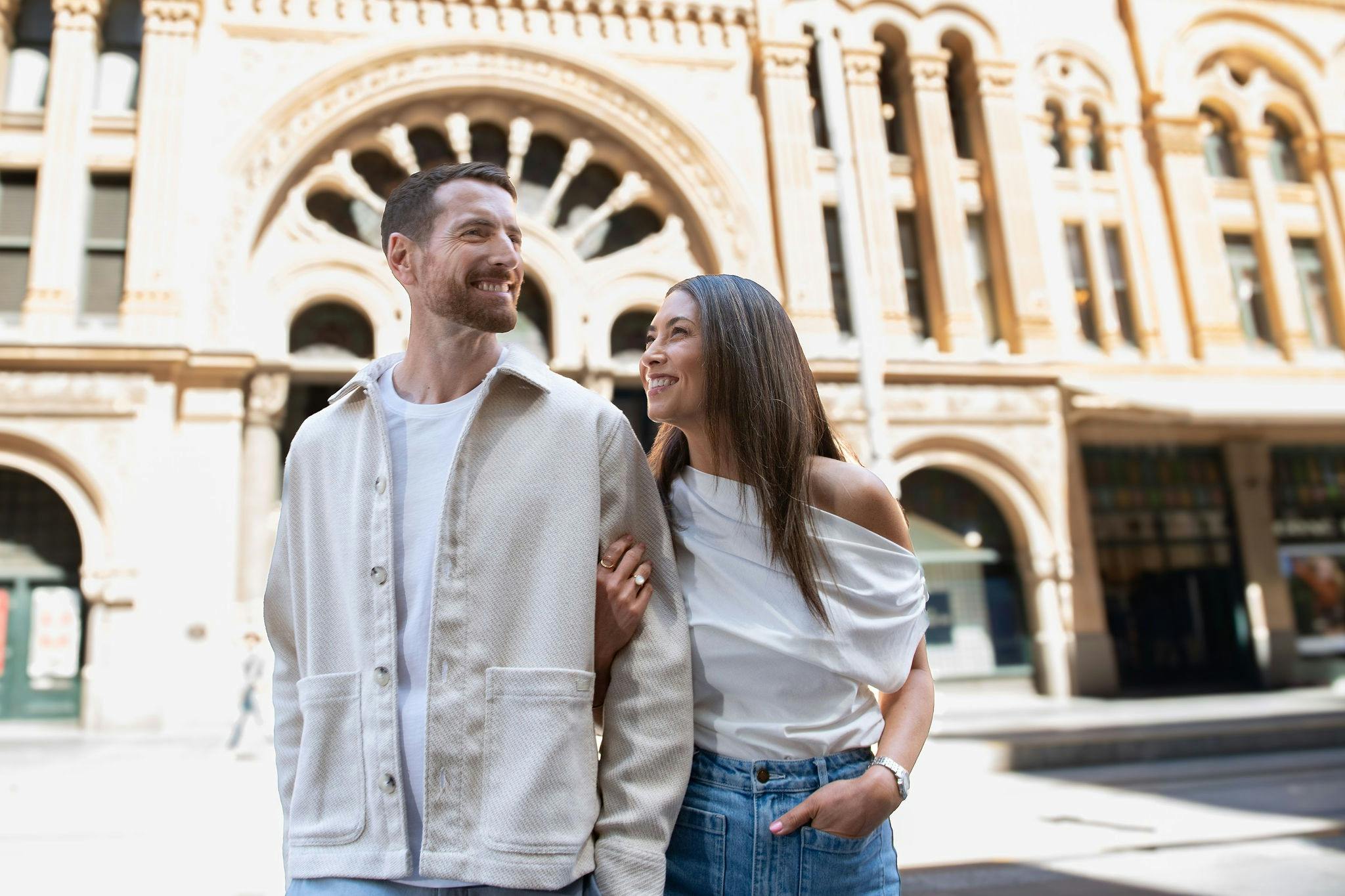 A couple arriving back to Hilton Sydney after shopping at the QVB on George St in Sydney.