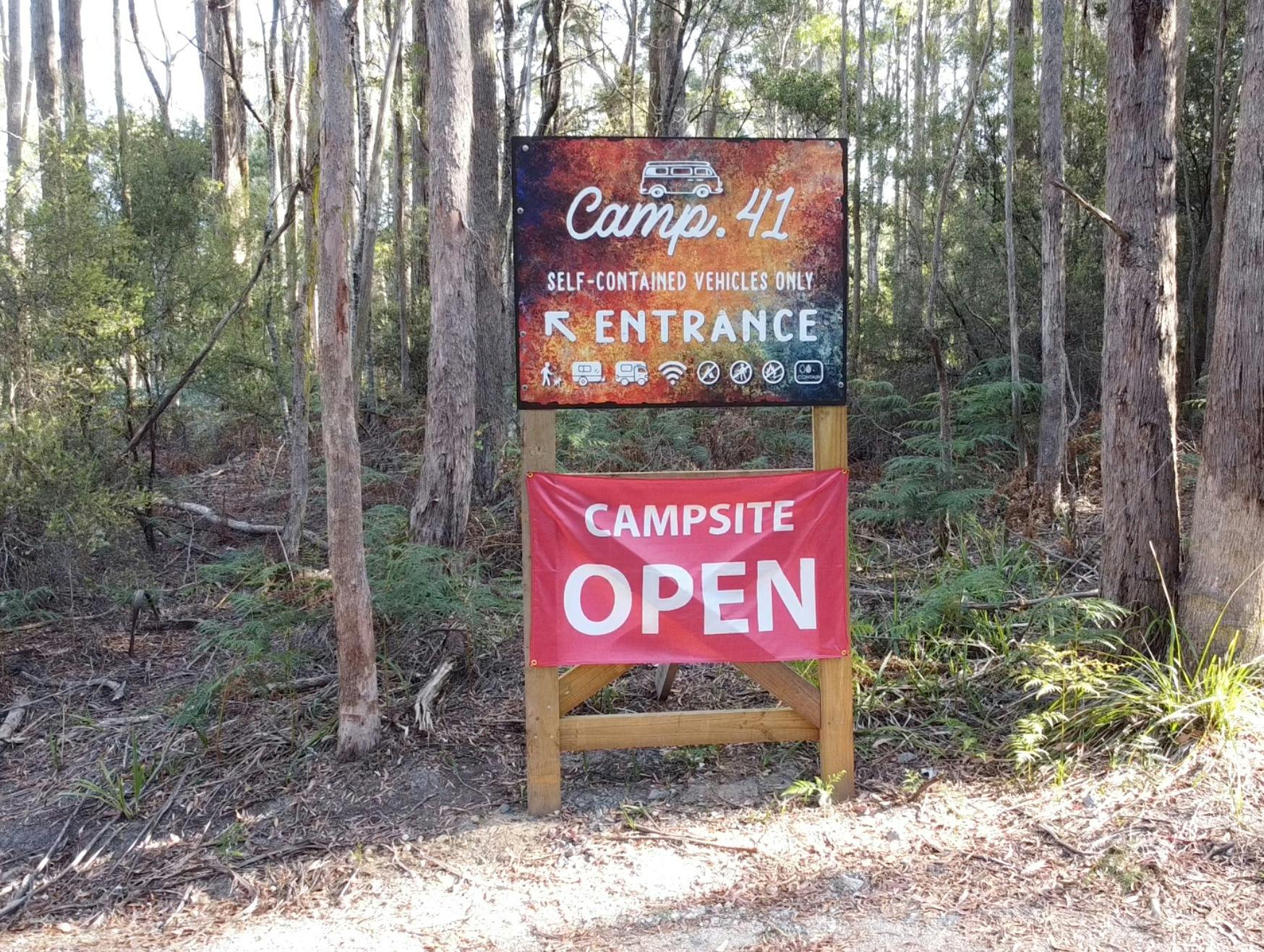 A sign showing the entrance to Camp 41 and advising that they are now open.