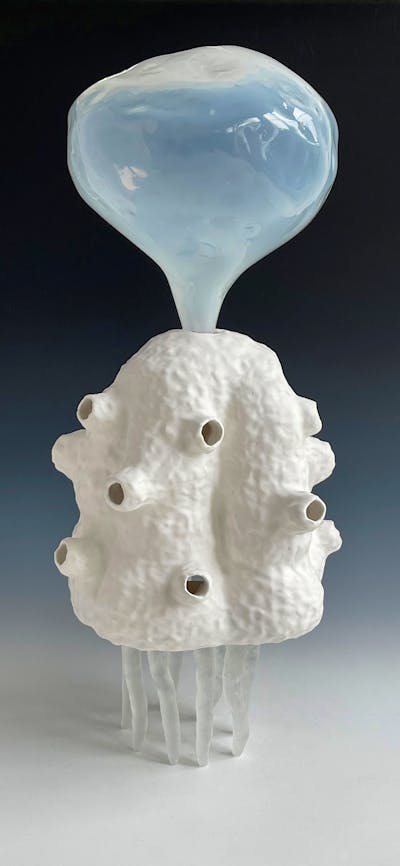 Lynda Draper artwork, made of glazed ceramic and studio blown glass, on grey background