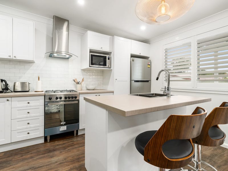 Kitchen with appliances and amenities