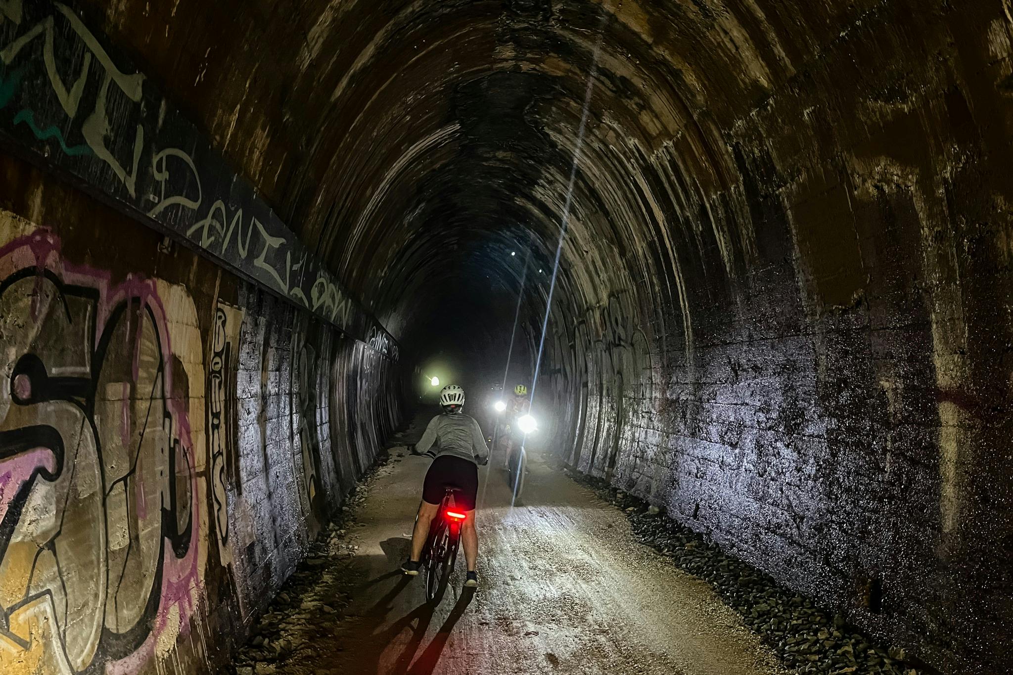 Shot inside the 524m tunnel on the Northern Rivers Rail Trail, see front and rear lights of E Bikes.