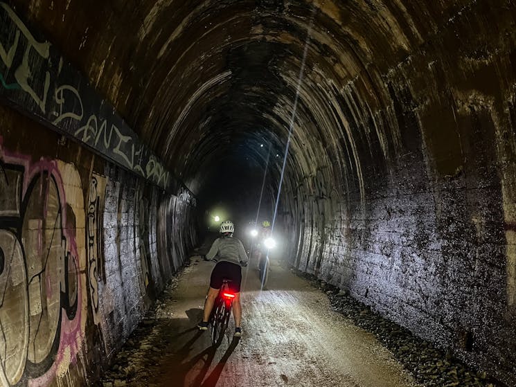 Shot inside the 524m tunnel on the Northern Rivers Rail Trail, see front and rear lights of E Bikes.
