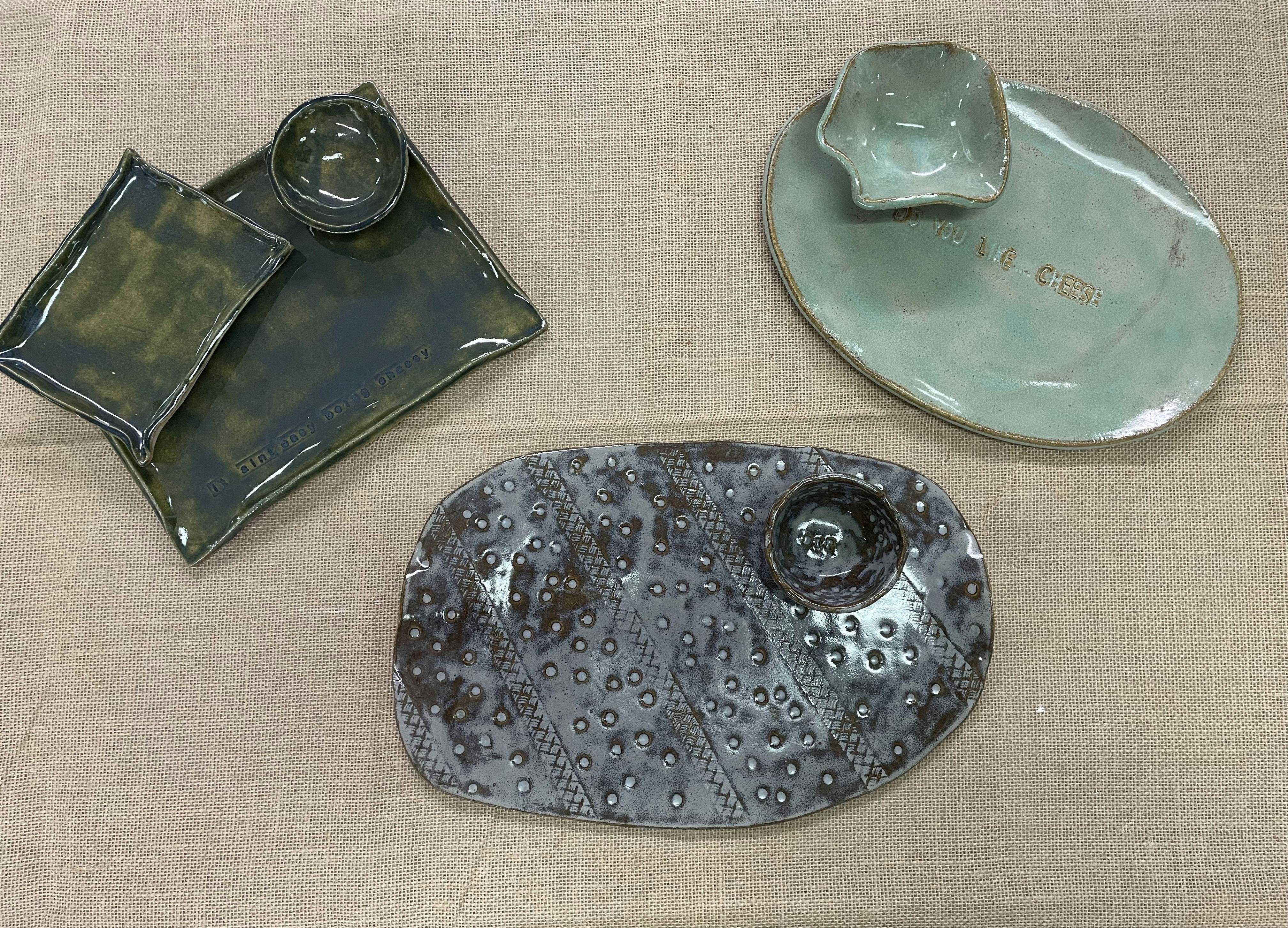 Image of a variety of pottery charctuerie platters