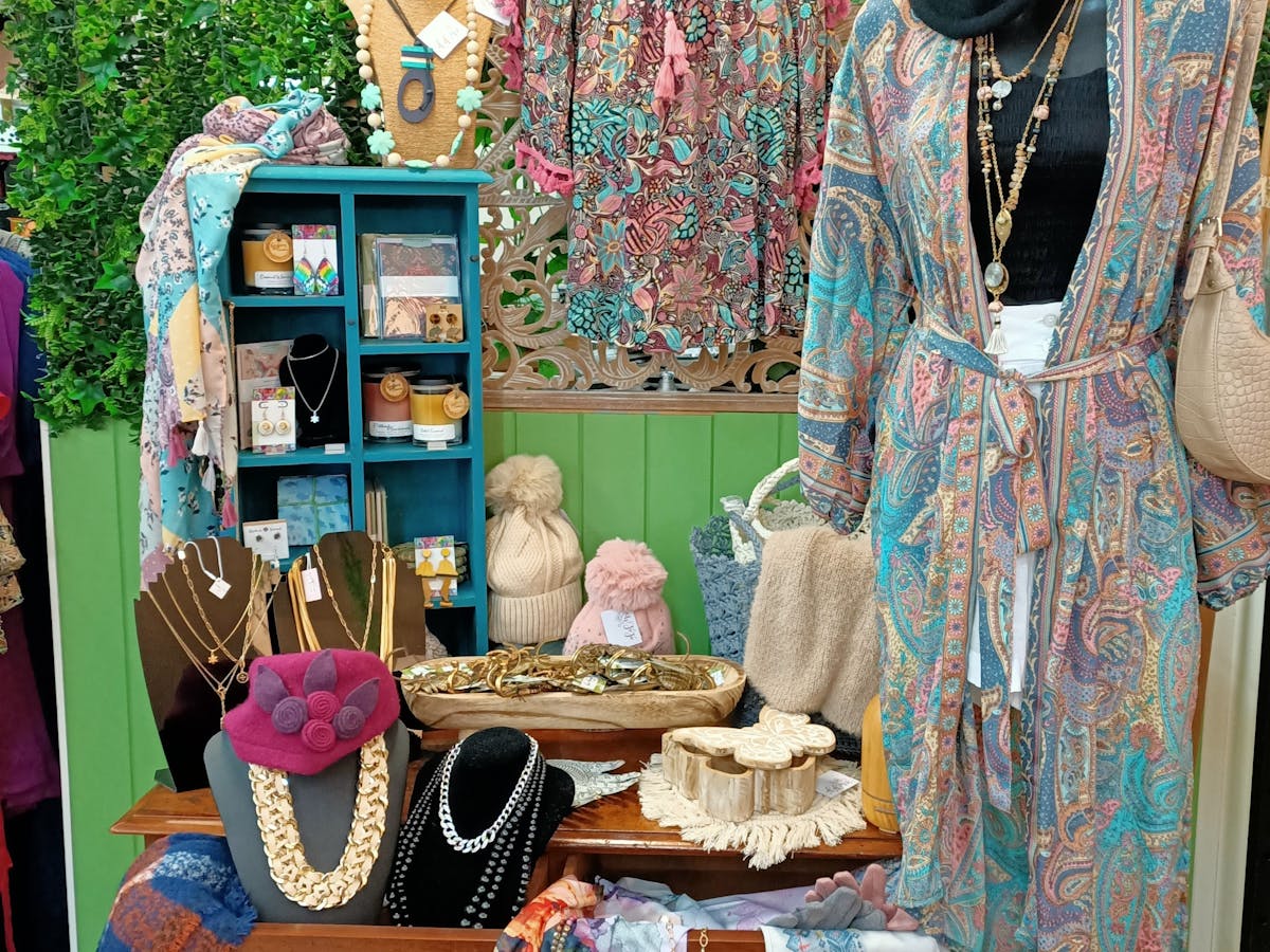 Silk blend dress and kimono displayed with scarves, jewellery and decorator pieces