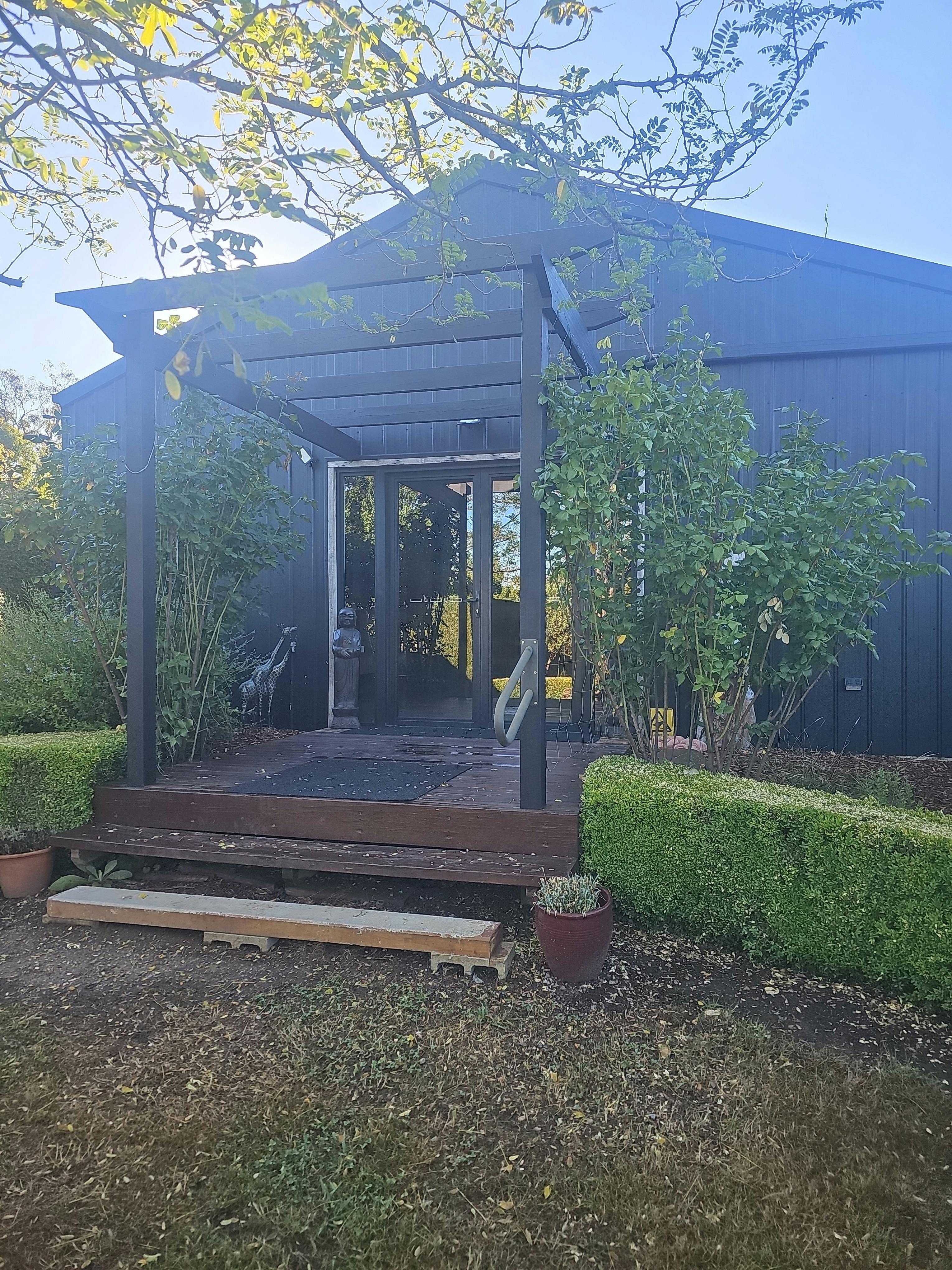 Gallery entrance with lots of greenery
