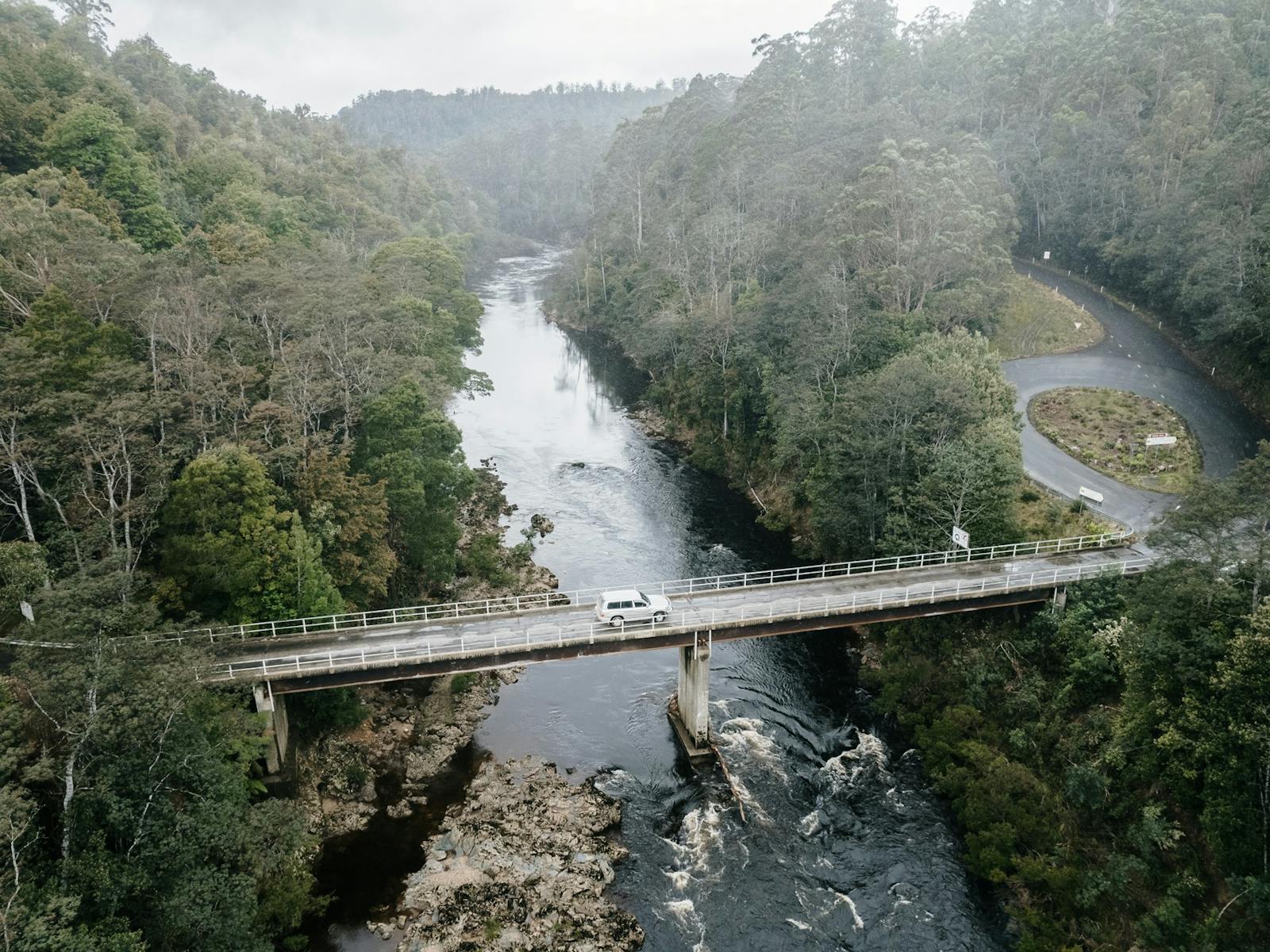 Aerial shot of the vehicle driving across the Arthur River