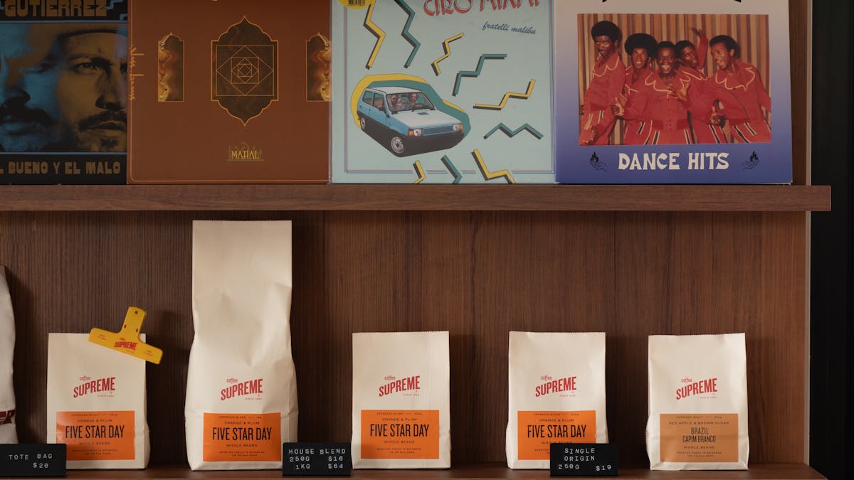 Record vinyl player with great rotating music genres, plus shop to buy merchandise and coffee beans.