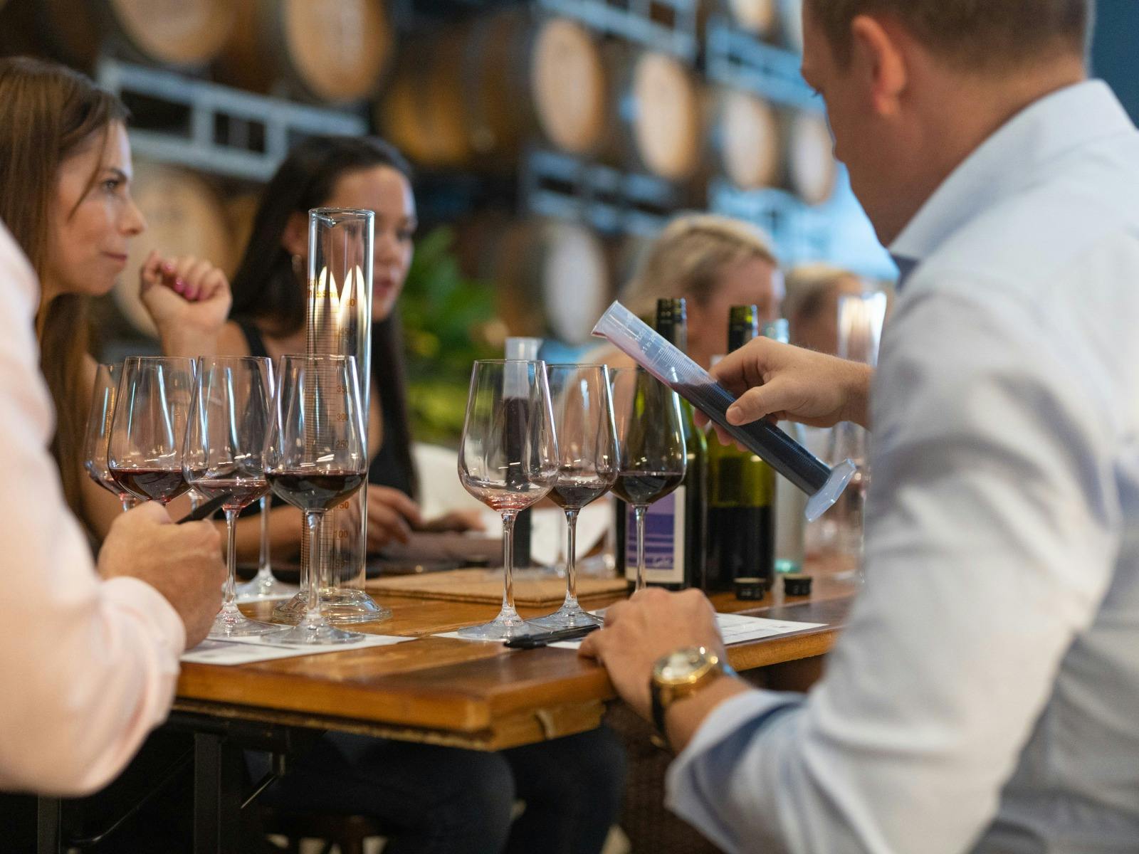 Person completing wine blending workshop worksheet