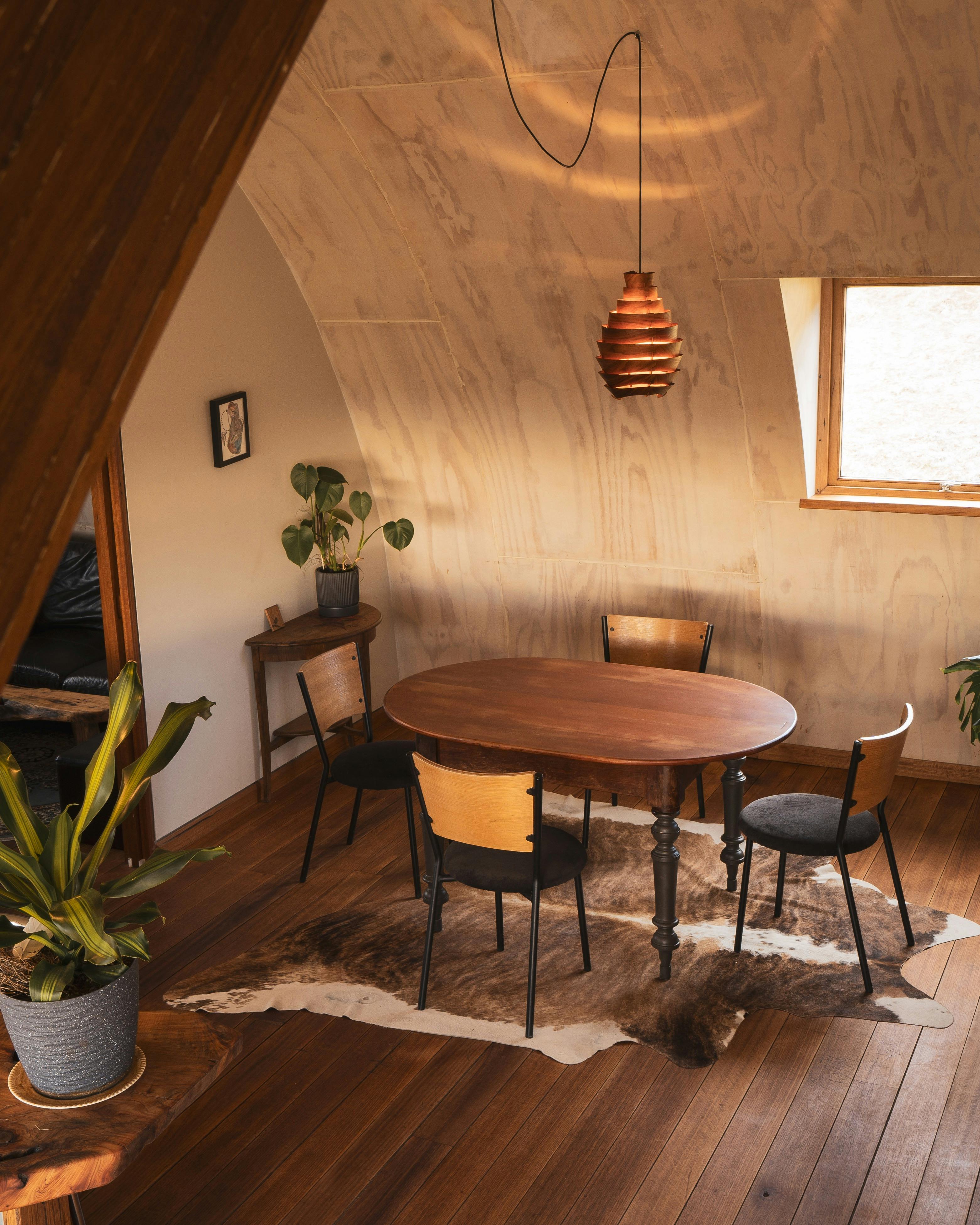 Our curved home, made in beautiful timbers bathed in warm afternoon light.