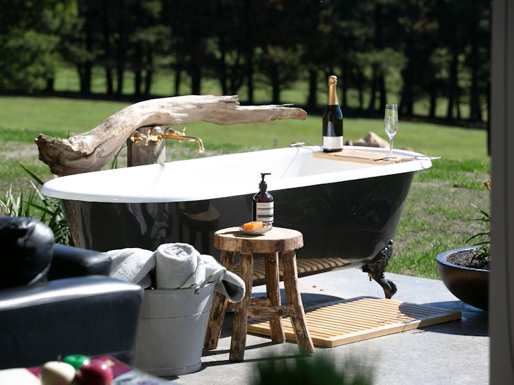 Enjoy a champagne as the sunsets in the outdoor bath