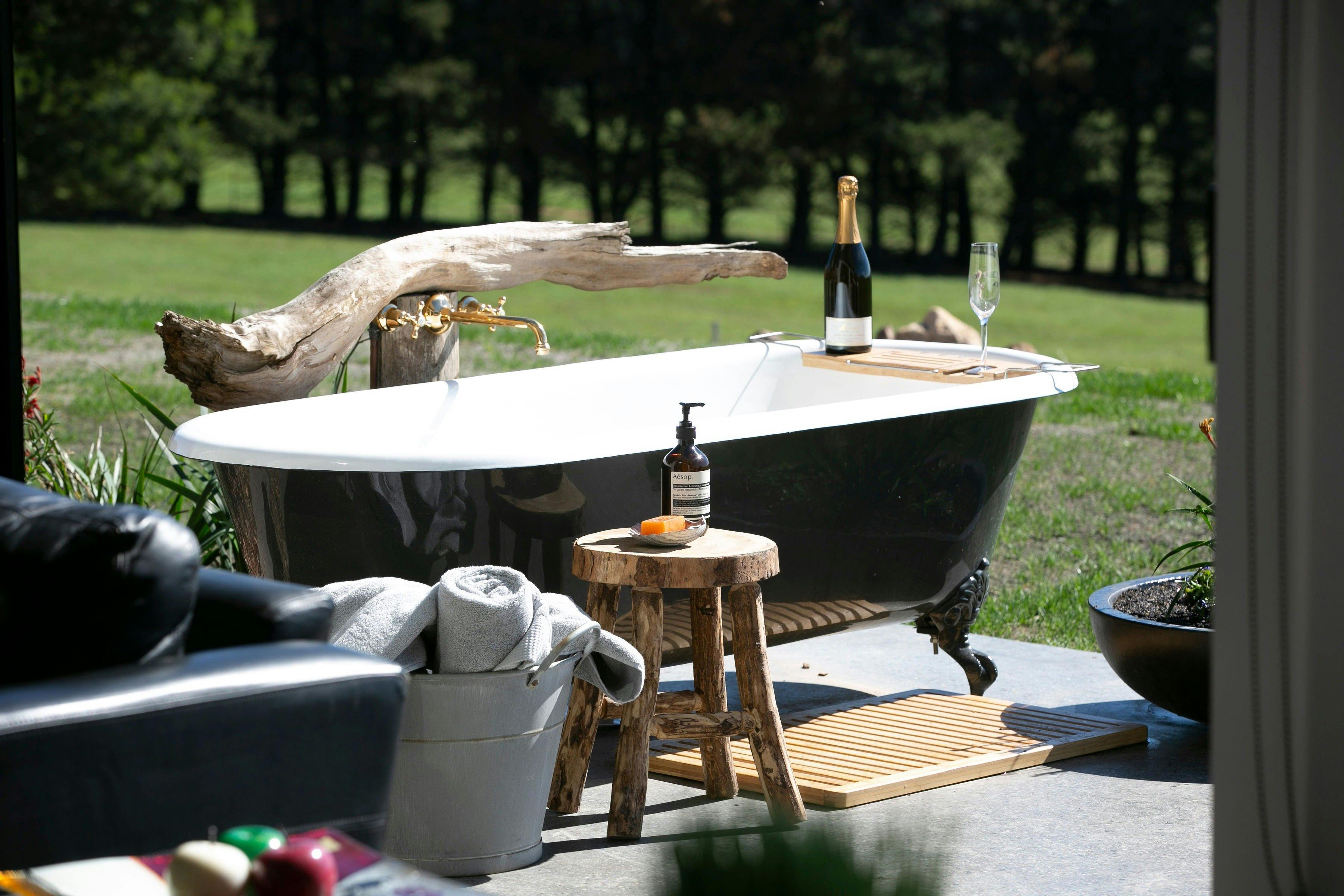 Enjoy a champagne as the sunsets in the outdoor bath