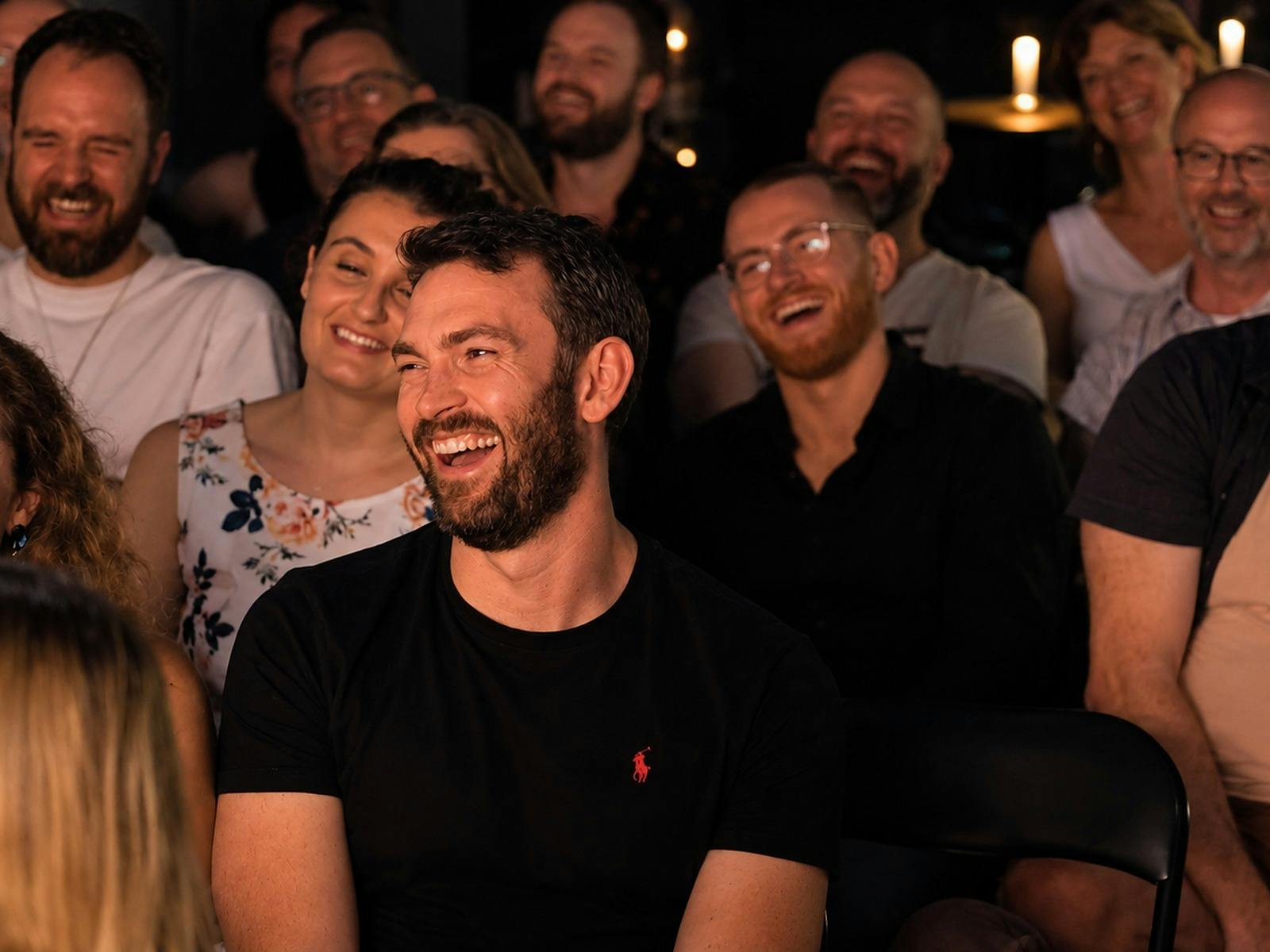Comedy fans laughing during a stand-up show at The Drummer, Glebe