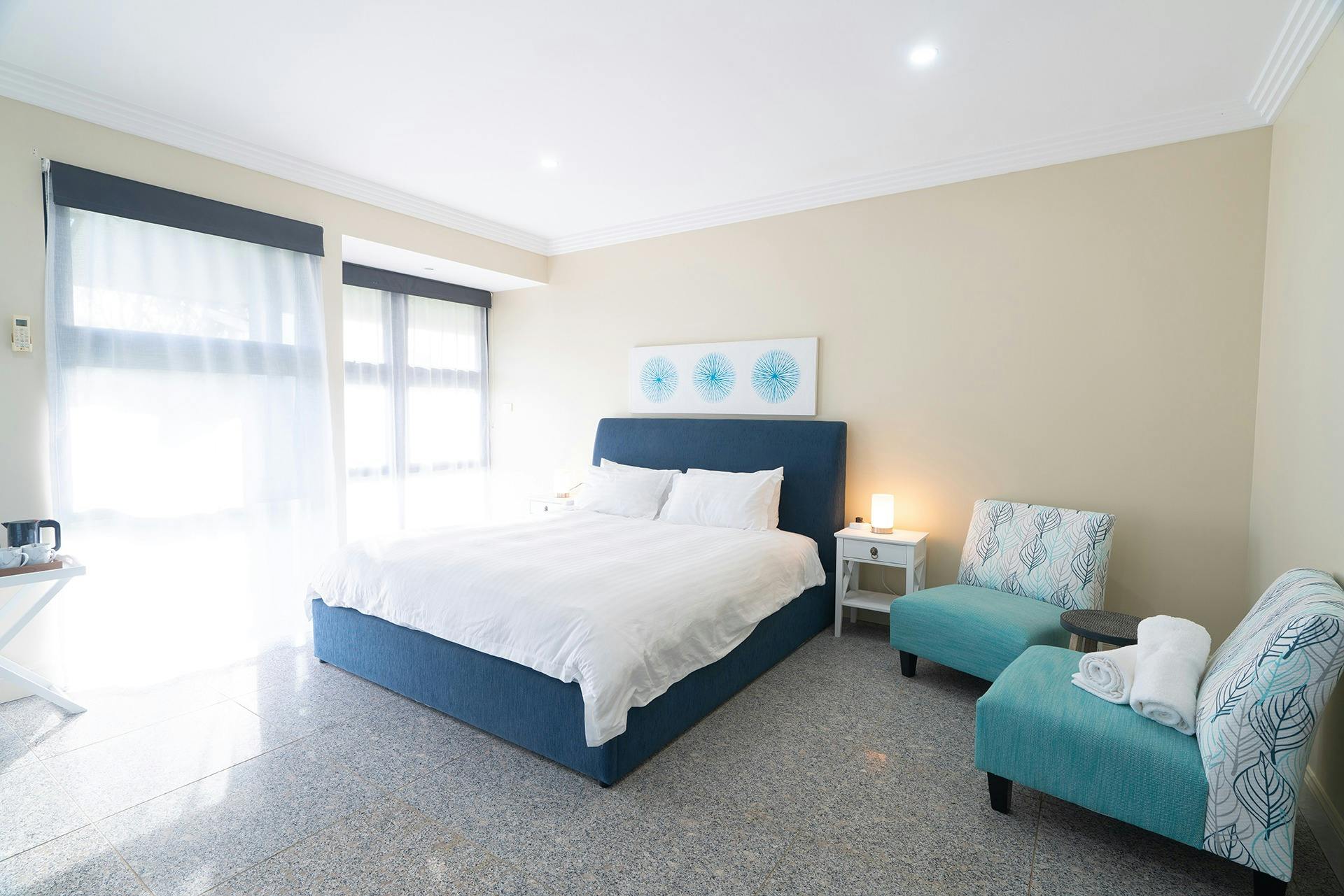 Suite 5 - light filled room with King bed, plus single bed; lots of space around the room