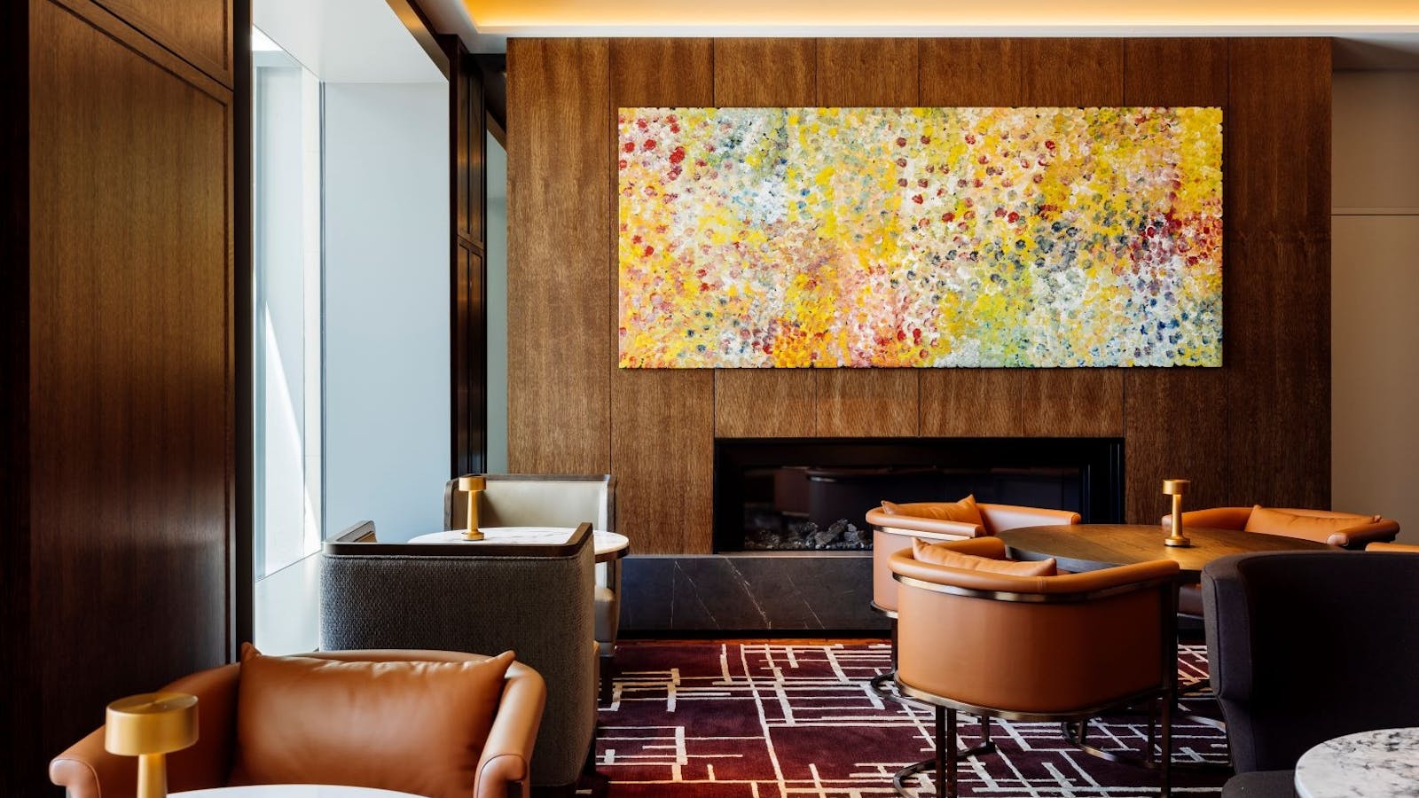 Deco Lounge with tables set near fireplace