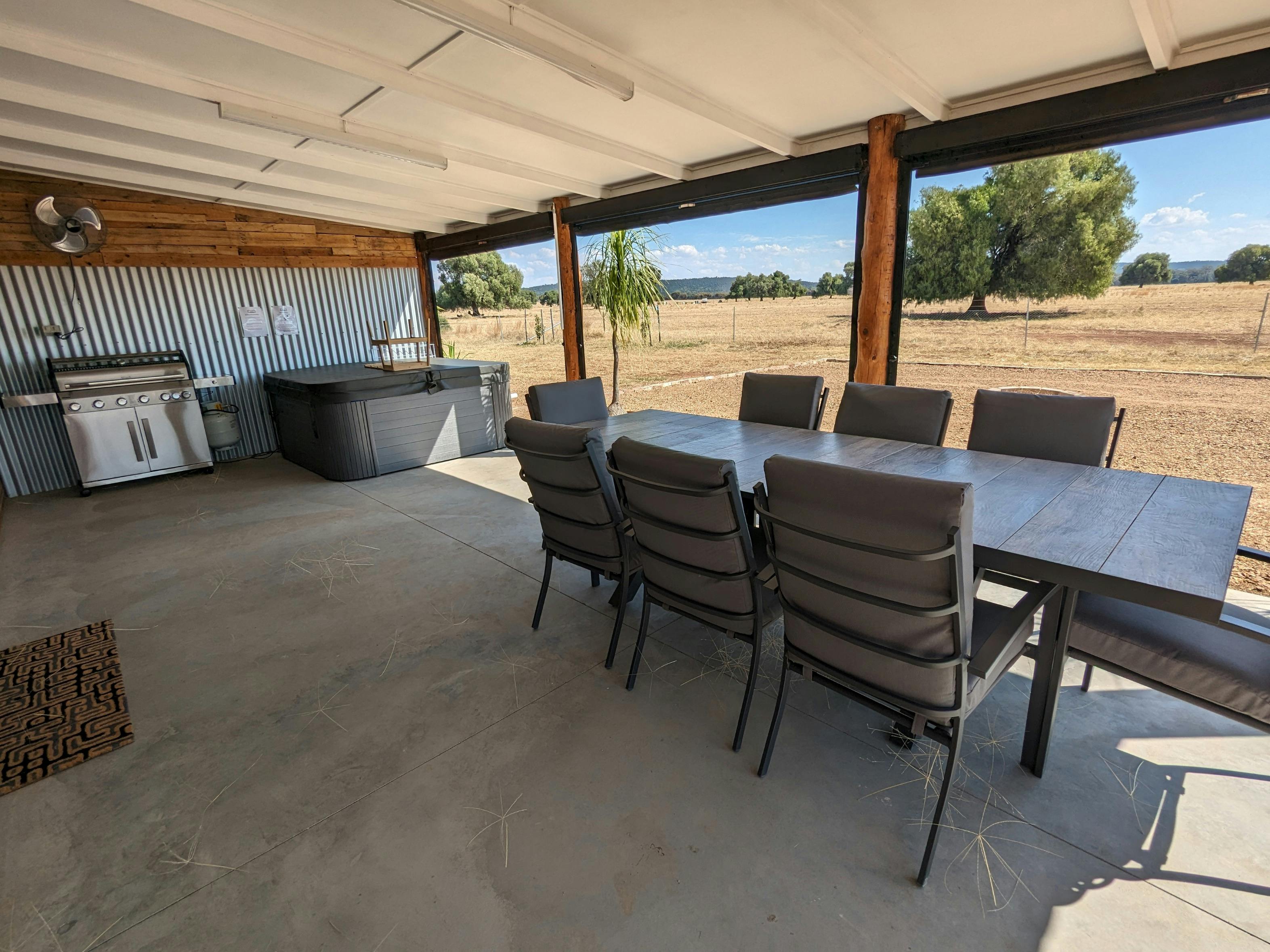 The deck has a large outdoor dining table, bbq and spa. The blinds can be used in inclement weather