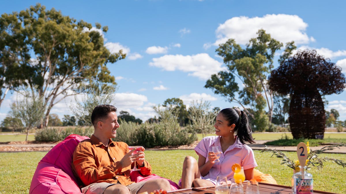 Guests enjoy a grazing platter, cocktails and tasting paddle on the lawn