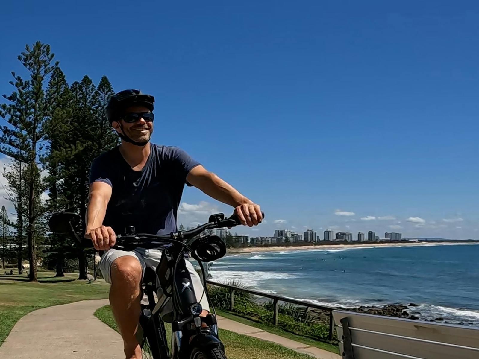Smiling face enjoying the with Maroochy beach in the background. Smiling face enjoying the with Maroochy beach in the background.