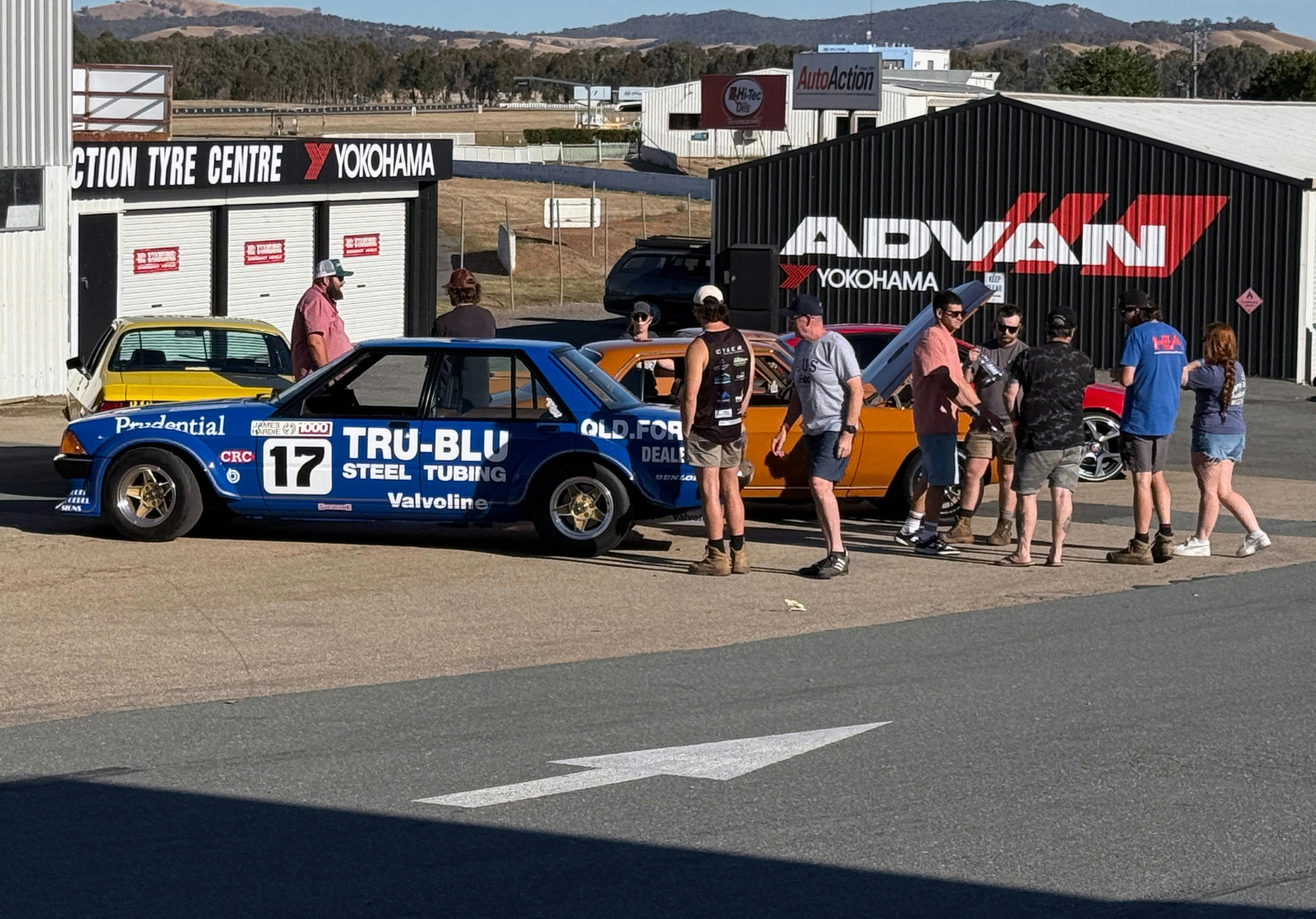 People looking at cars