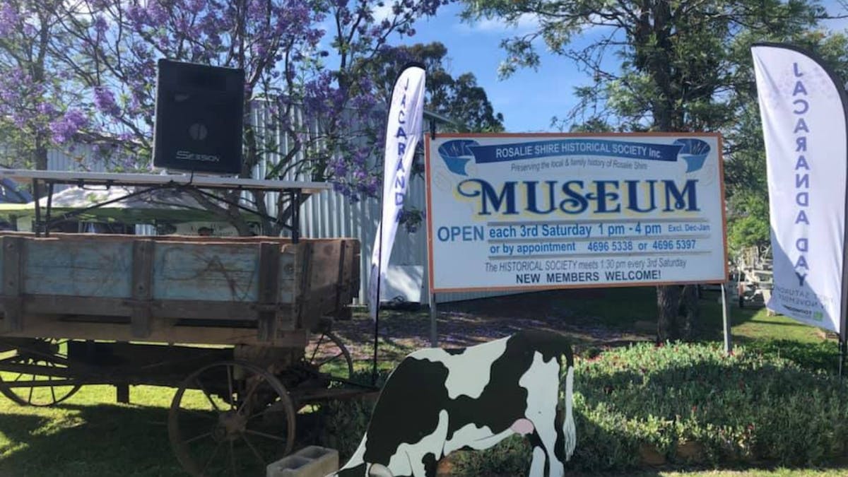 Picture of Rosalie Shire Historical Society Museum sign, historical equipment & Jacaranda Day signs