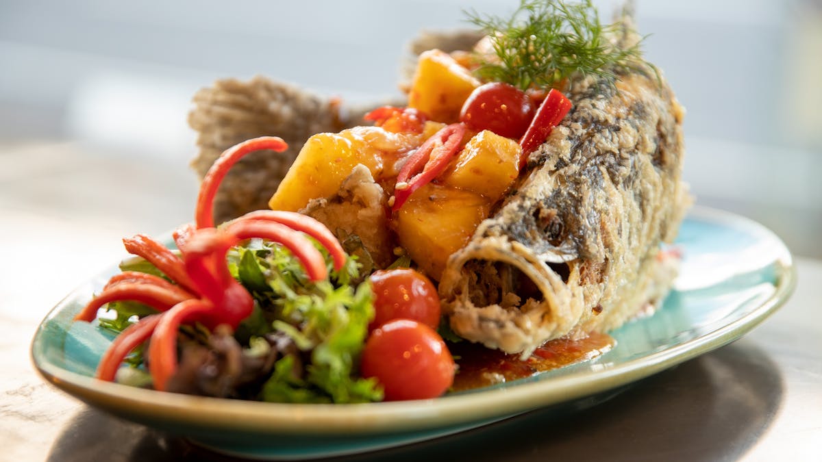 Deep fried whole Barramundi fish served with an authentic Thai 3 flavour sauce (sweet, sour, spicy)
