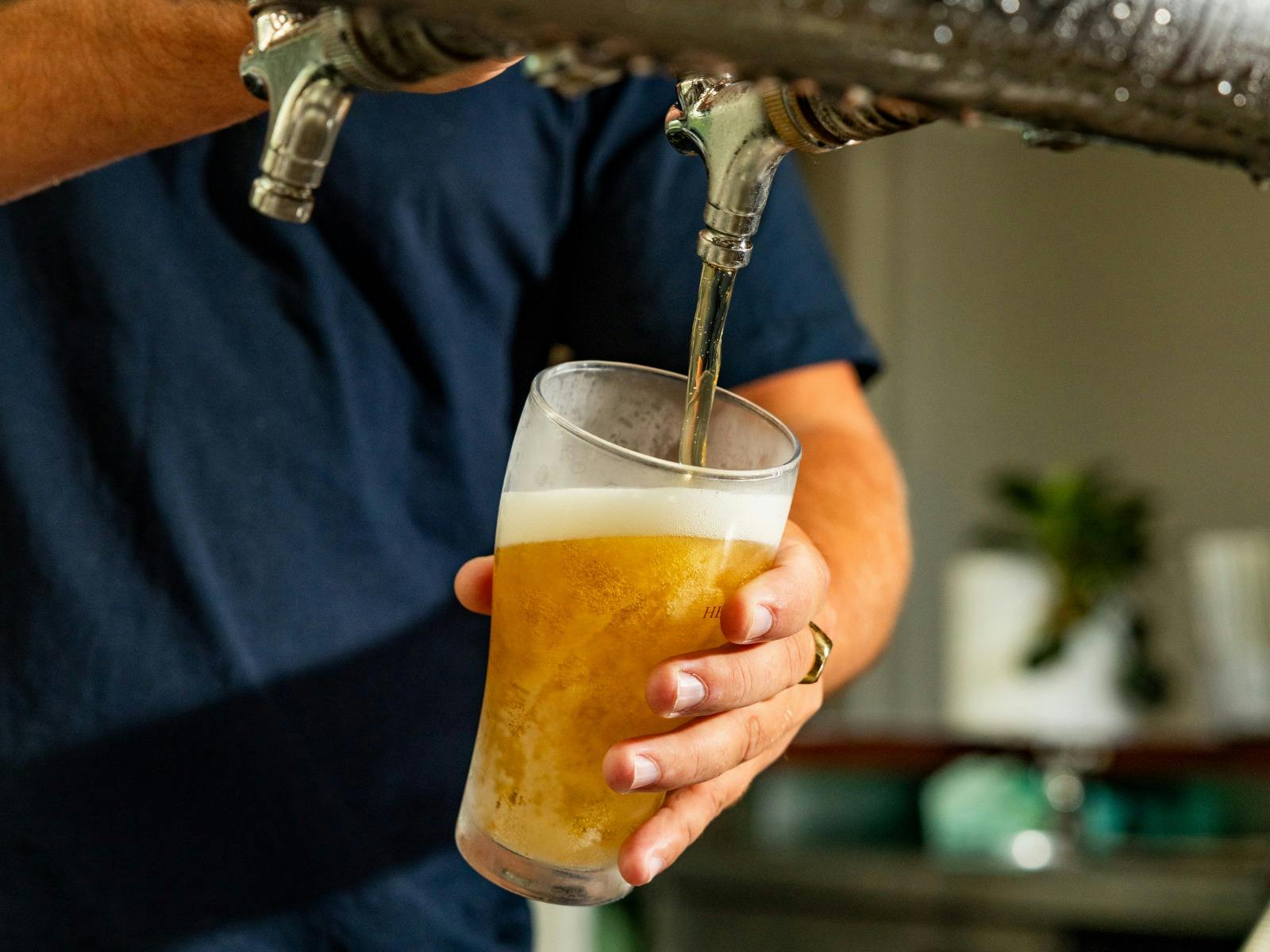 Beer being poured from a tap at Huskisson Hotel