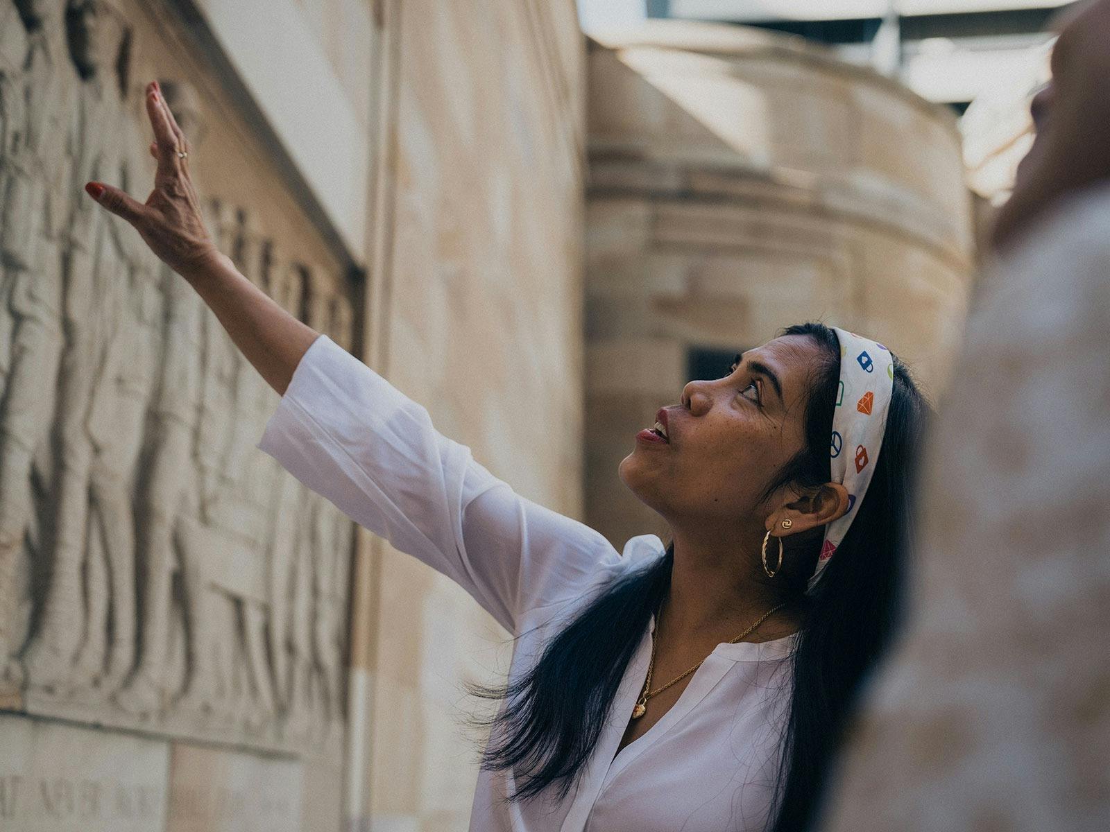 Woman admiring the Women's Memorial in the Anzac Square parklands