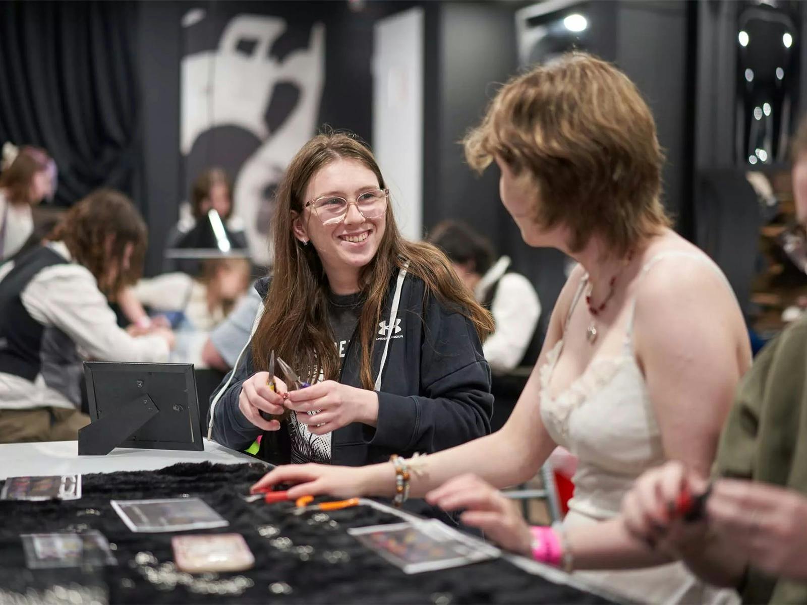 Two teenagers working together at a workshop