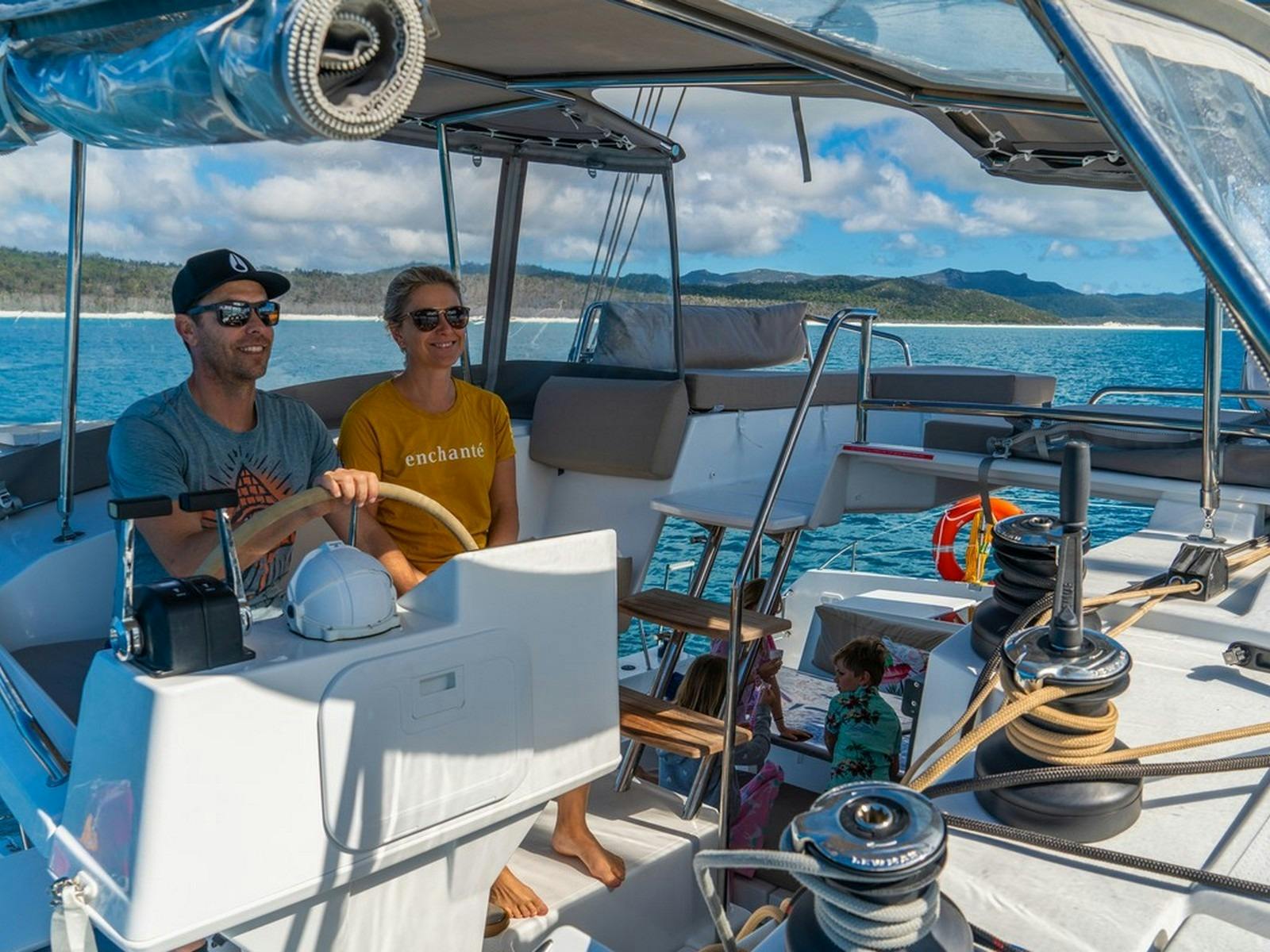 Man and woman at the helm of a boat
