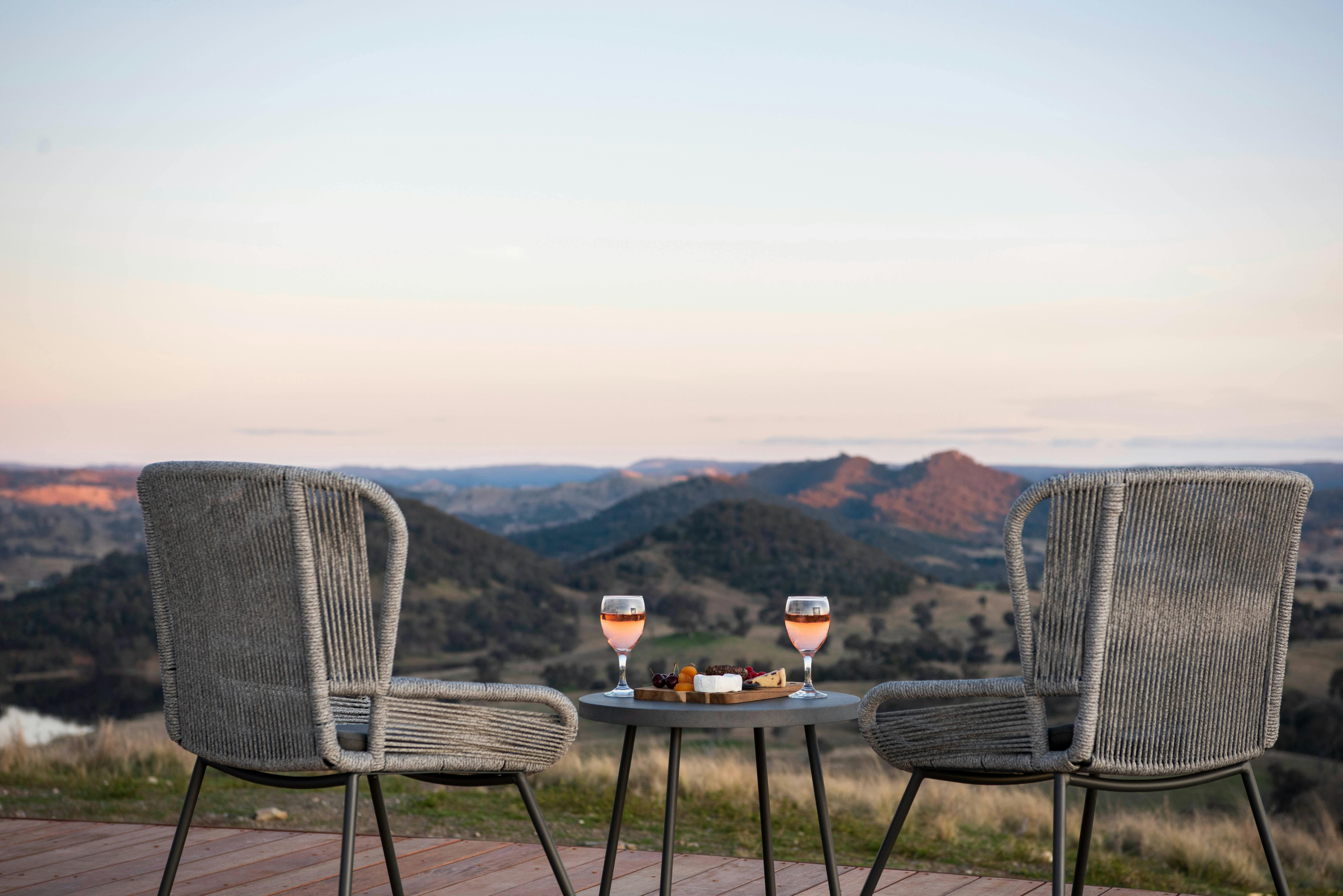 Wine and nibbles on the deck of glamping domeon the d