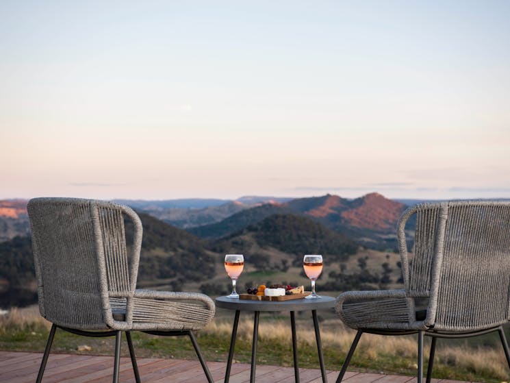 Wine and nibbles on the deck of glamping domeon the d