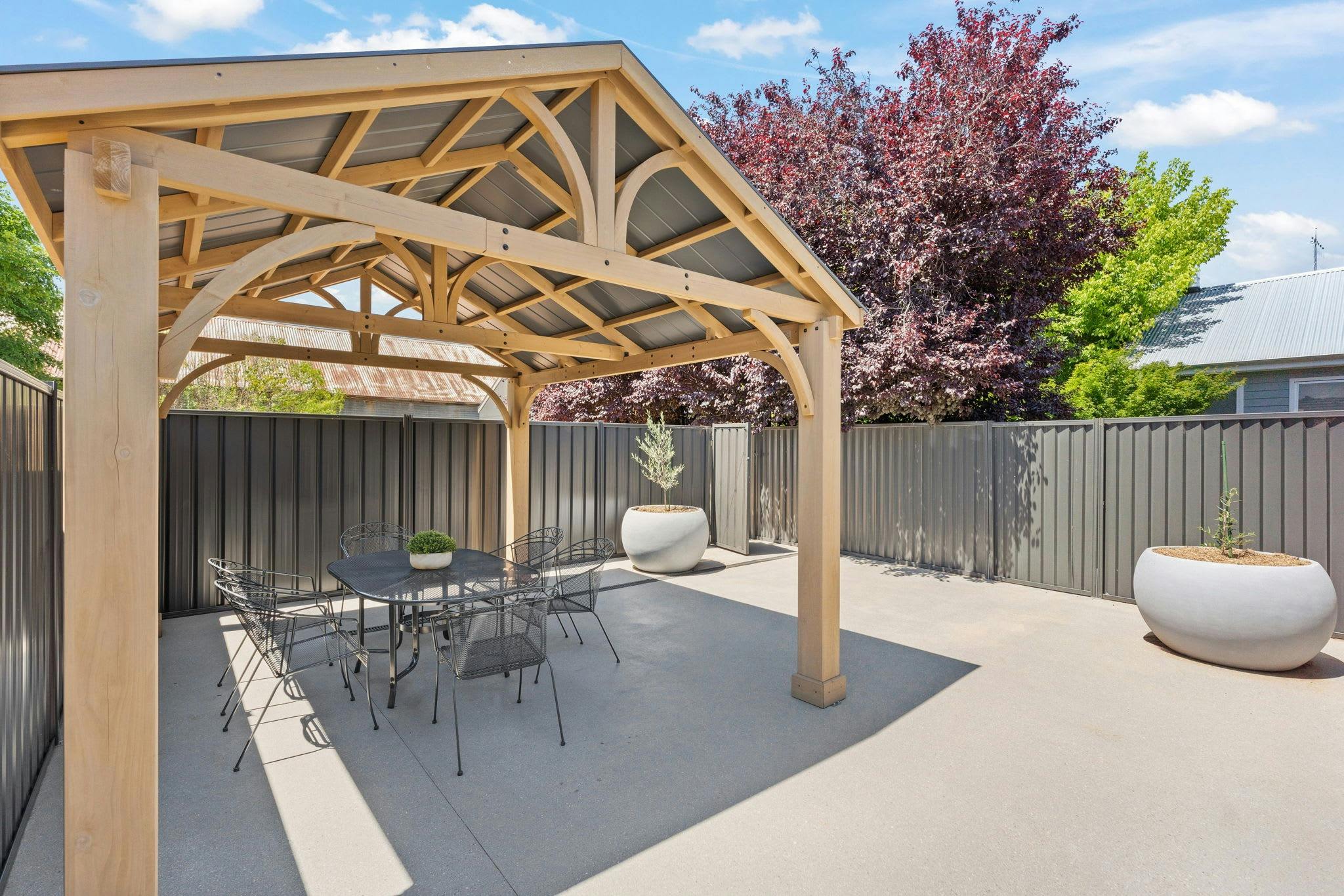 Outdoor dining table and chairs with undercover area