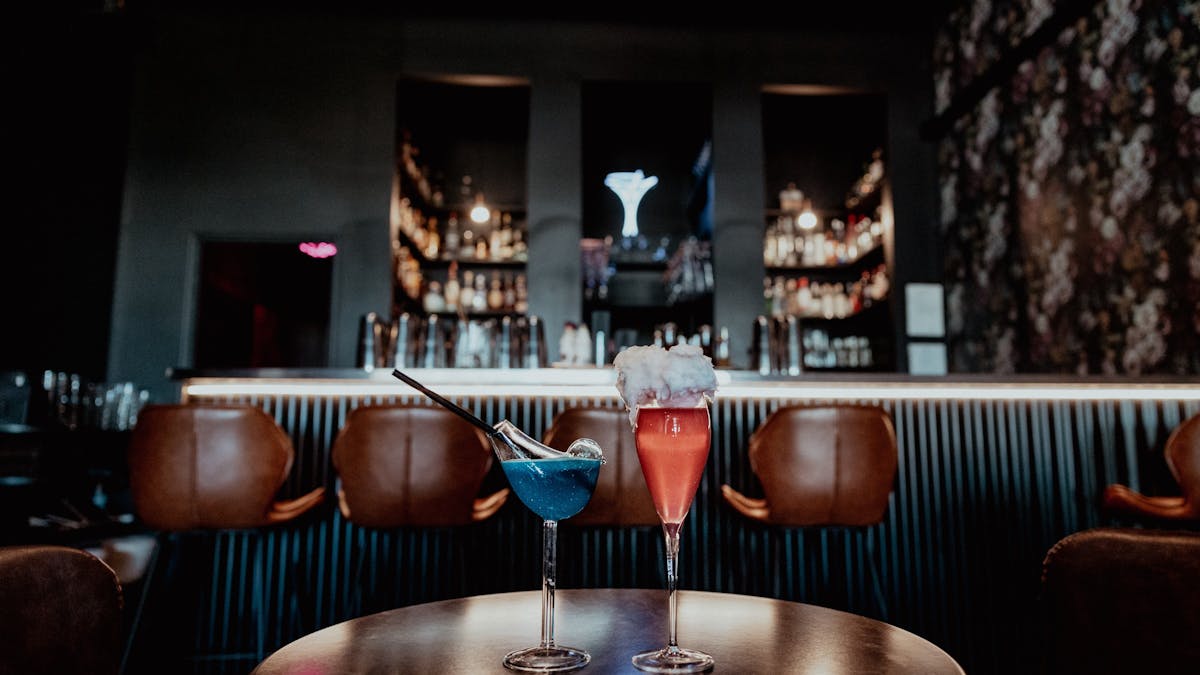 Three cocktails in front of the bar
