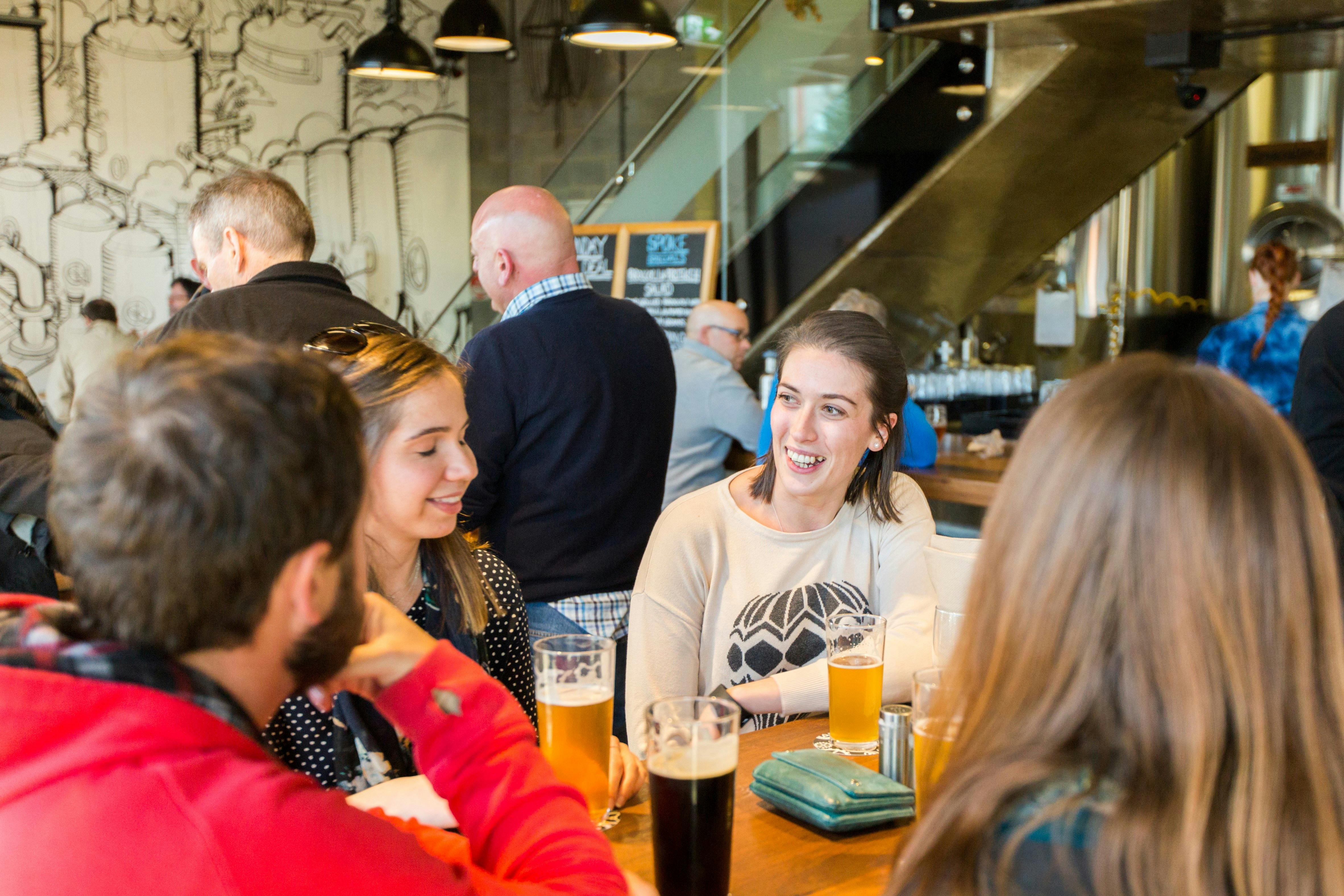 People having beers in the downstairs bar