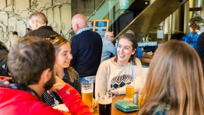 People having beers in the downstairs bar