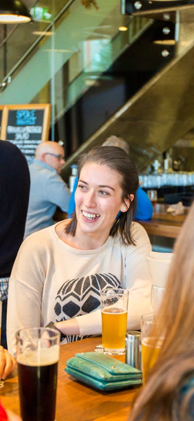 People having beers in the downstairs bar