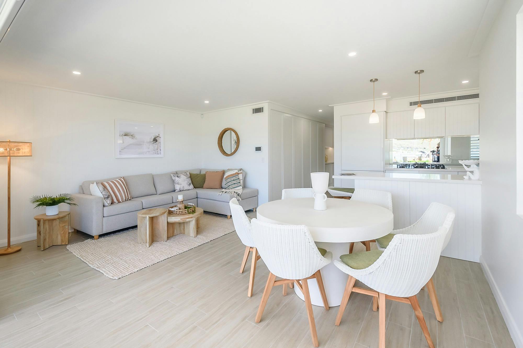 Lounge & Living area showing dining table, kitchen and grey lounge